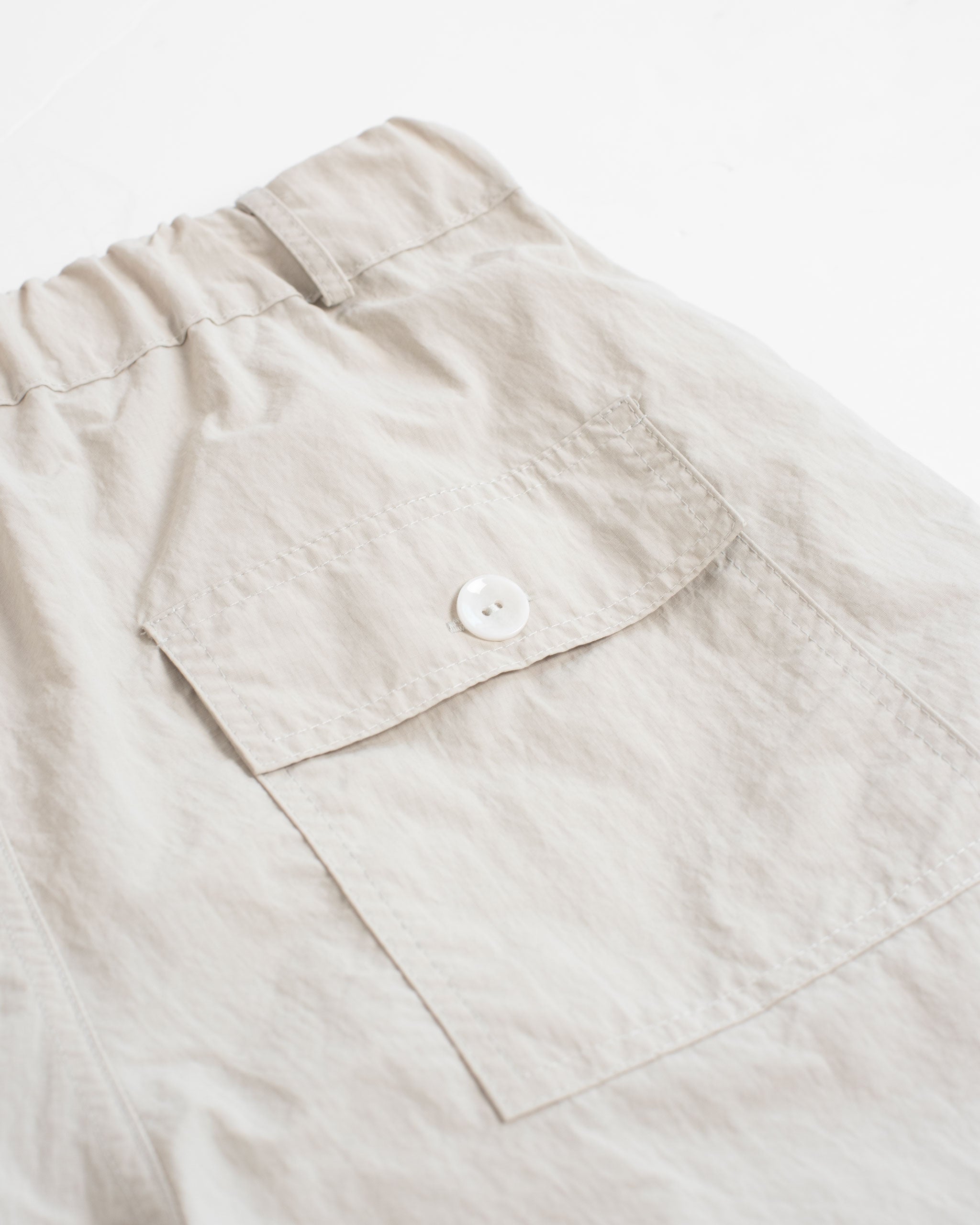 back pocket shot of Cream utility shorts in Ripstop nylon fabric