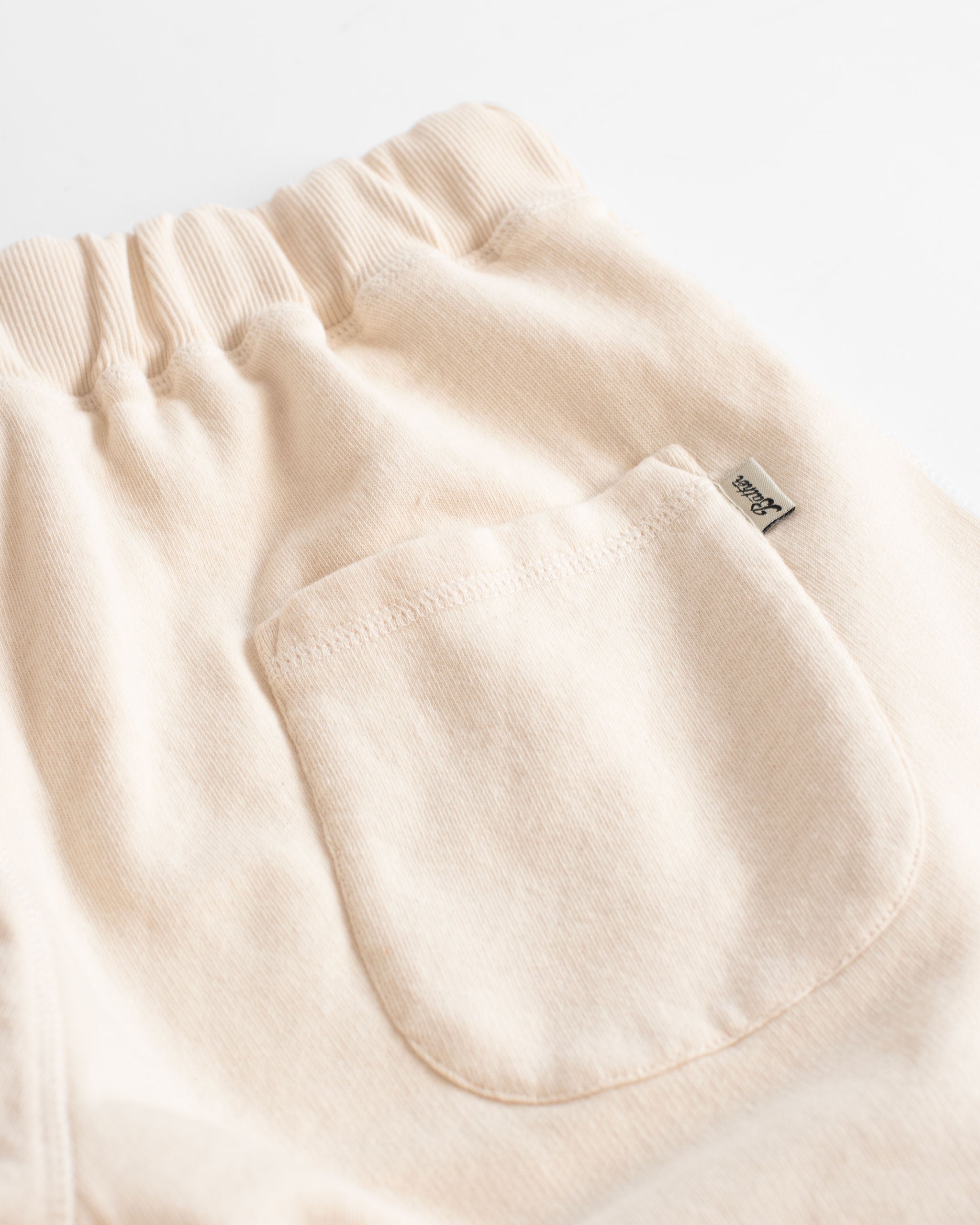 back pocket shot of Natural ivory french terry cotton Sweat Shorts