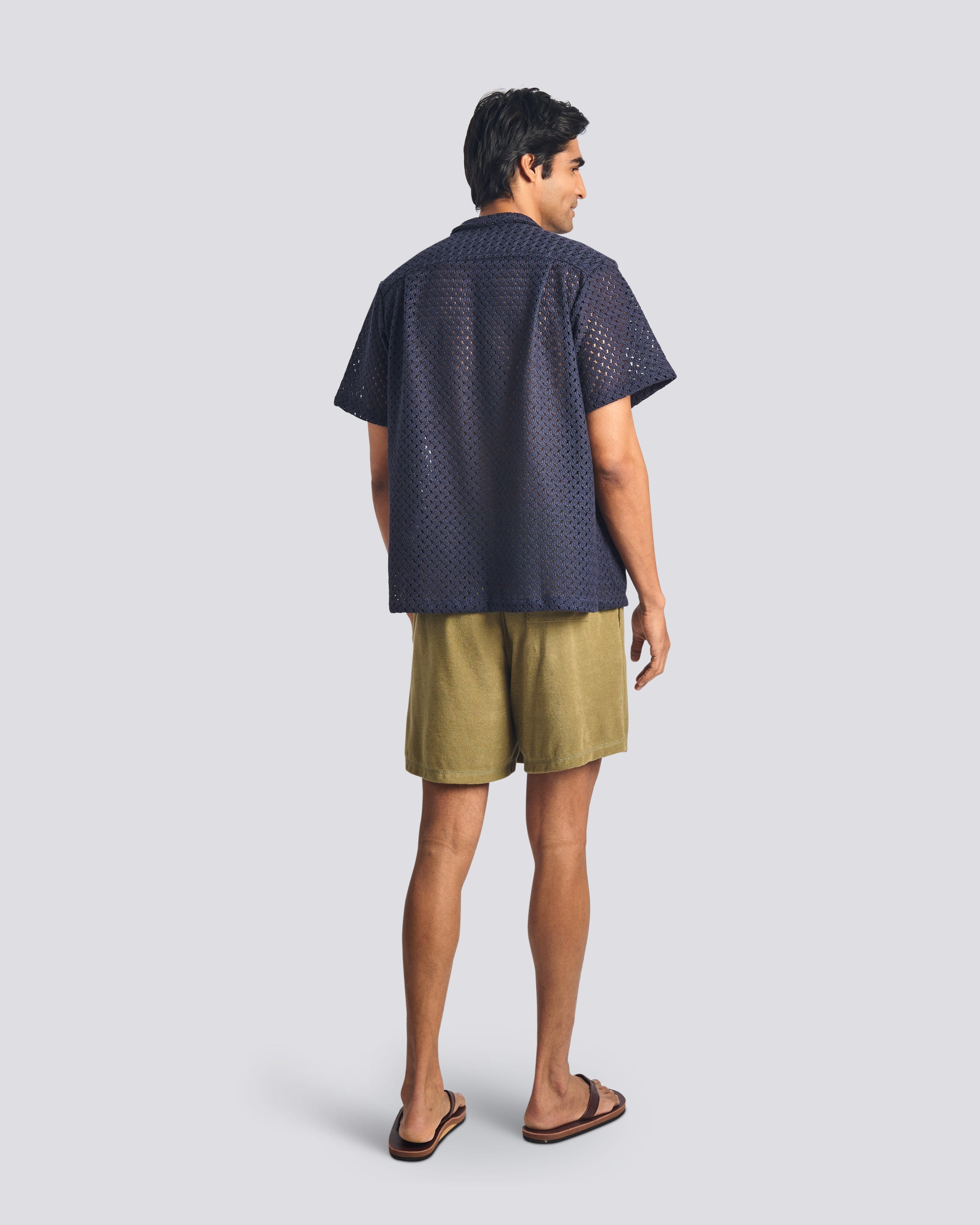 Bather men's army terry tour short on a model on white background from the back