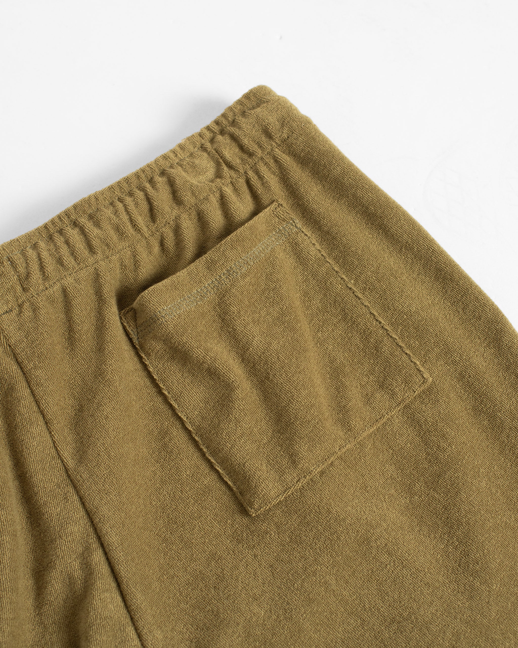 Closeup detail of the patch pocket on Bather men's army towel terry tour short.