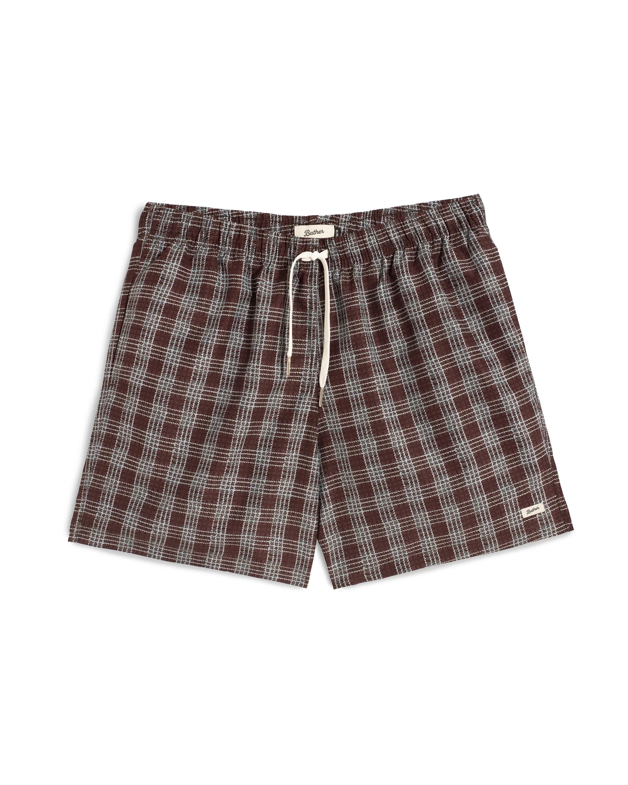 Plaid swim shorts with drawstring on a white background