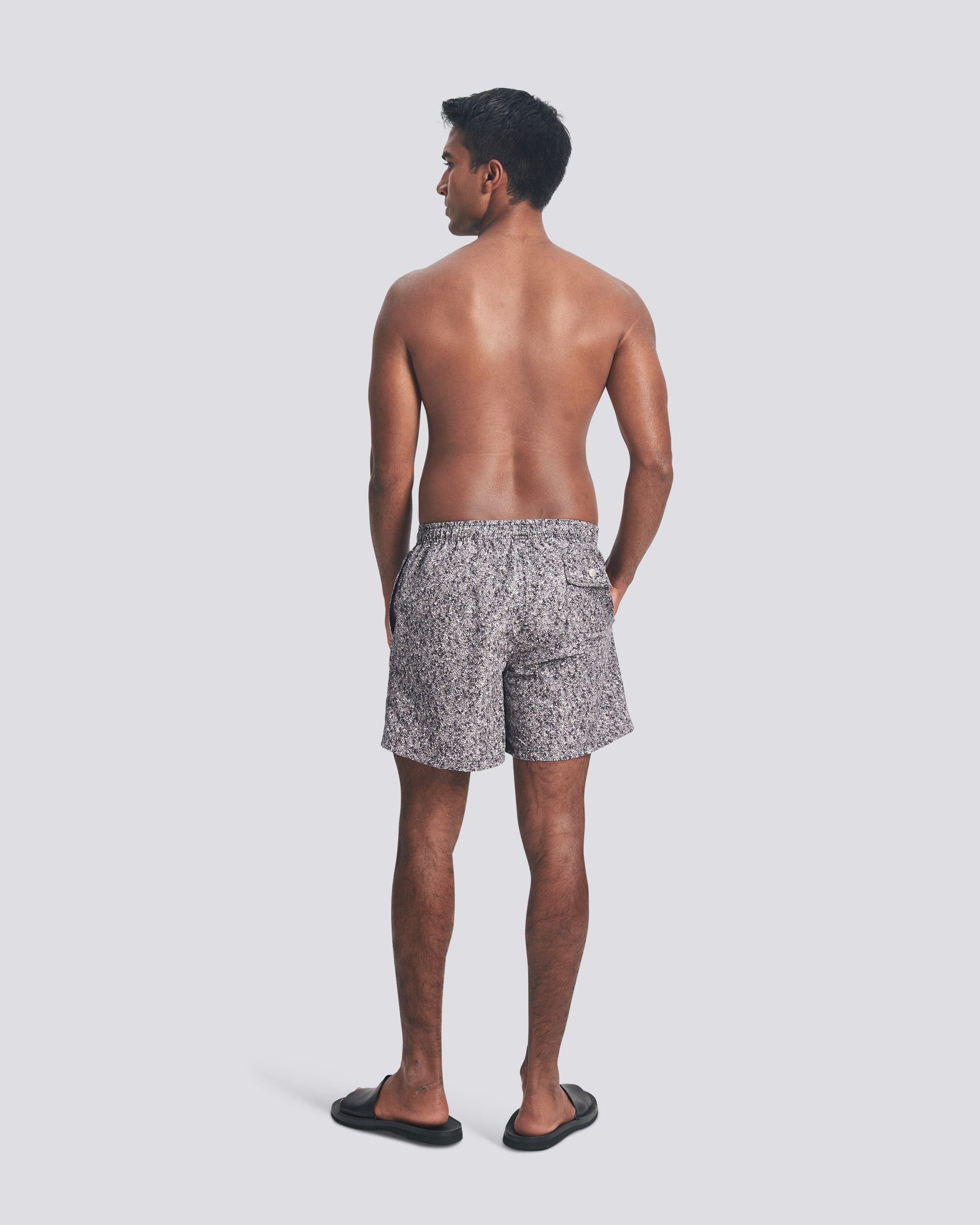 Man wearing Bather grey speckled print swim trunks