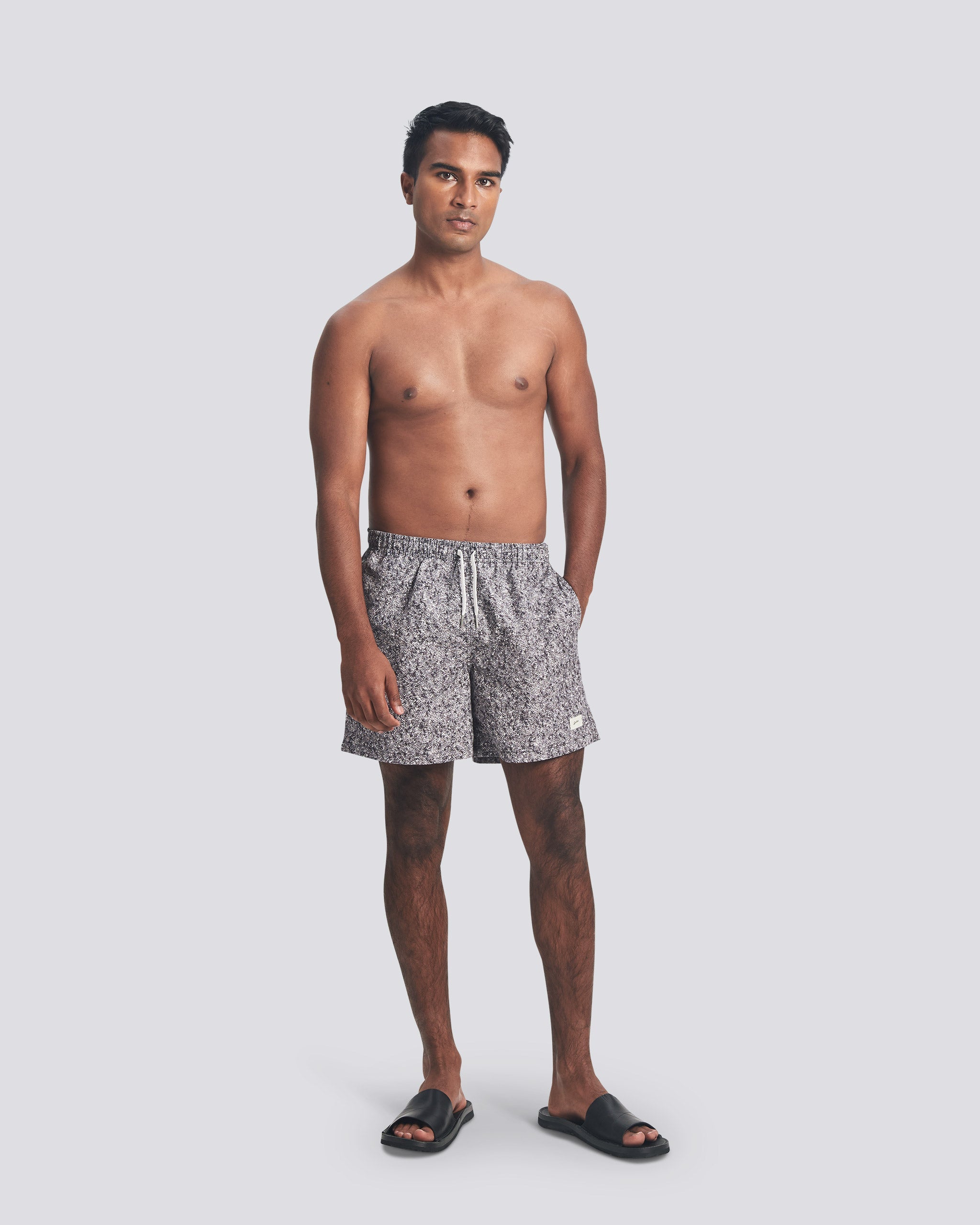 Man wearing Bather grey speckled print swim trunks