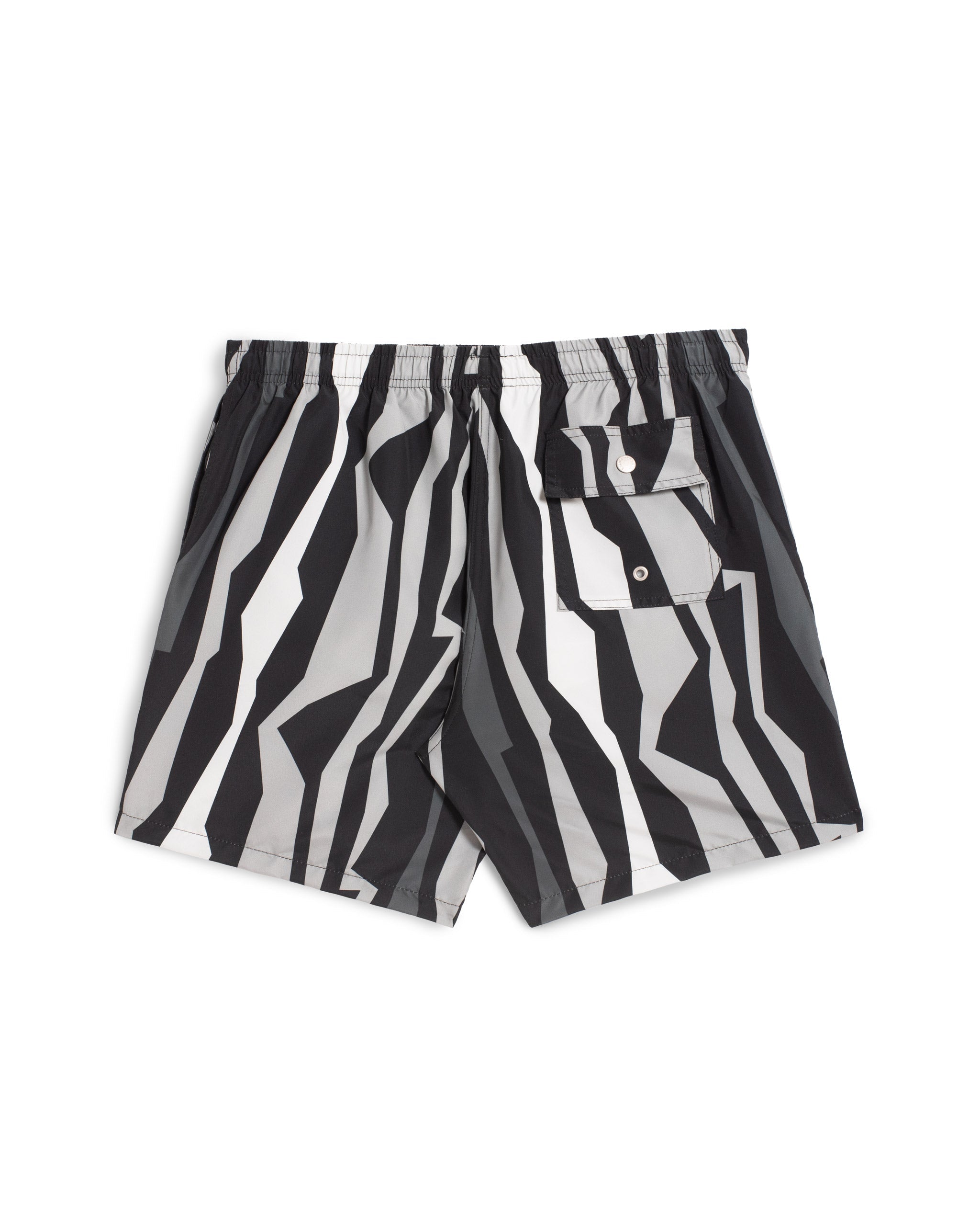 Rear view of men’s black and gray swim trunks with vertical jagged geometric striped pattern and drawstring waistband