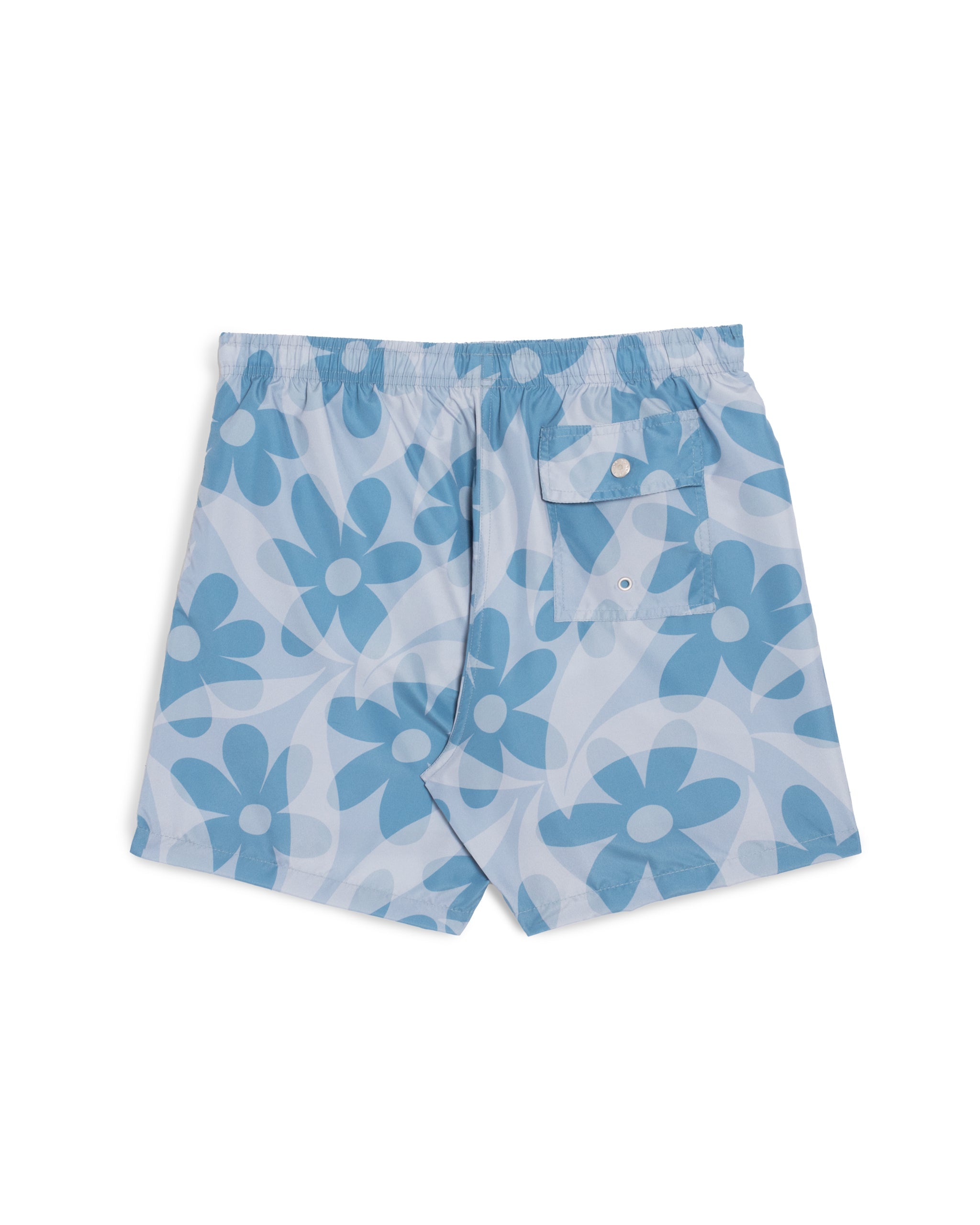 Rear view of men’s all over print swim trunks with layered floral pattern in light blue and dark blue tones featuring button closure back pocket