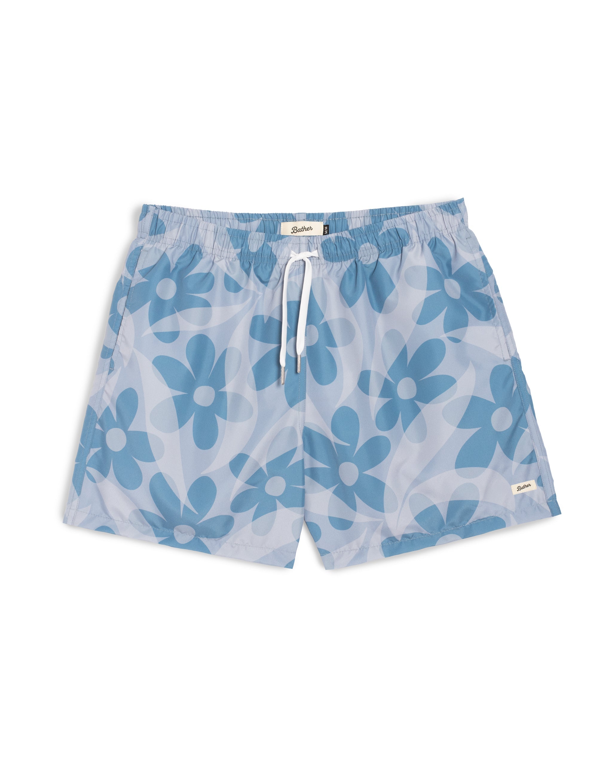 Men’s all over print swim trunks with layered floral pattern in light blue and dark blue tones featuring an elastic drawstring waistband