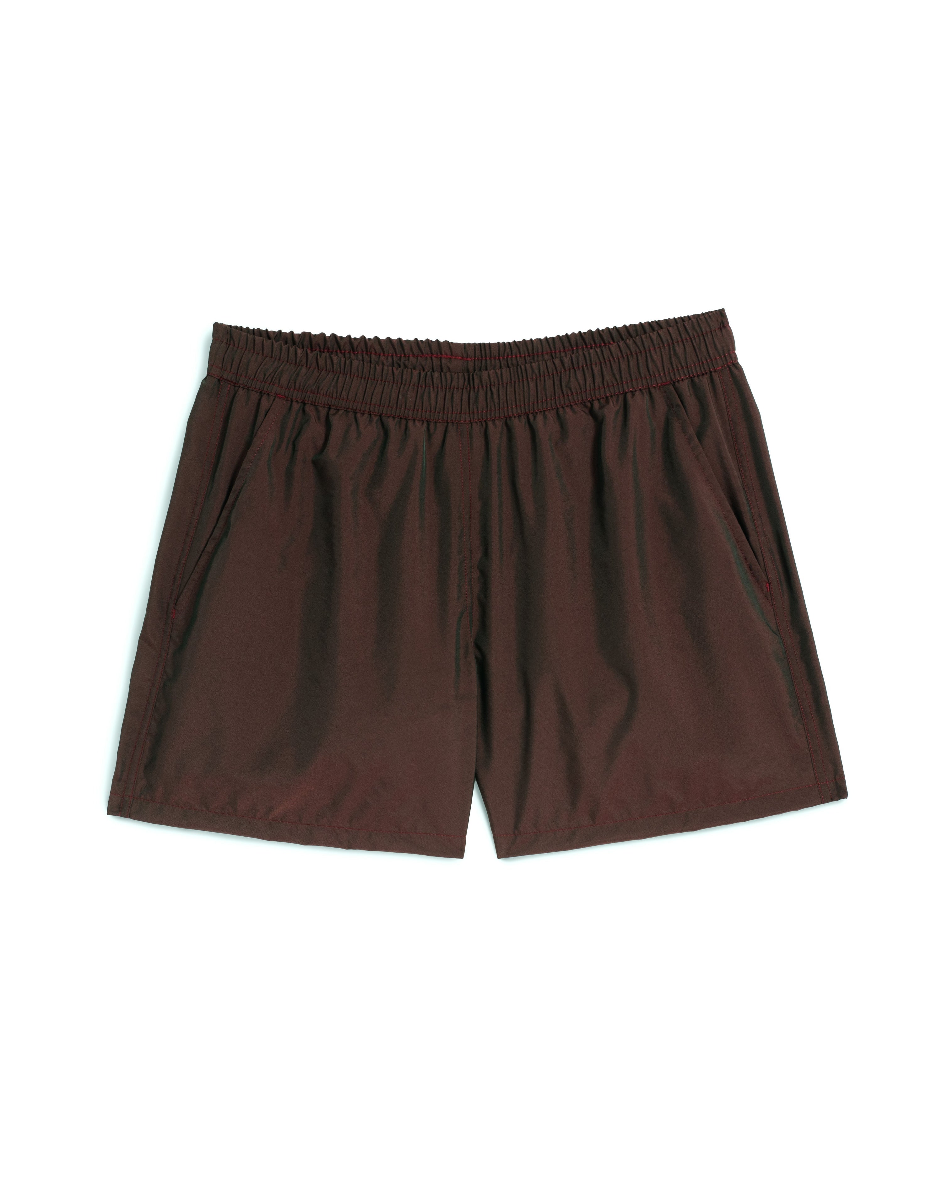 Men's shiny swim trunk in brown featuring an elastic drawstring waistband on white background