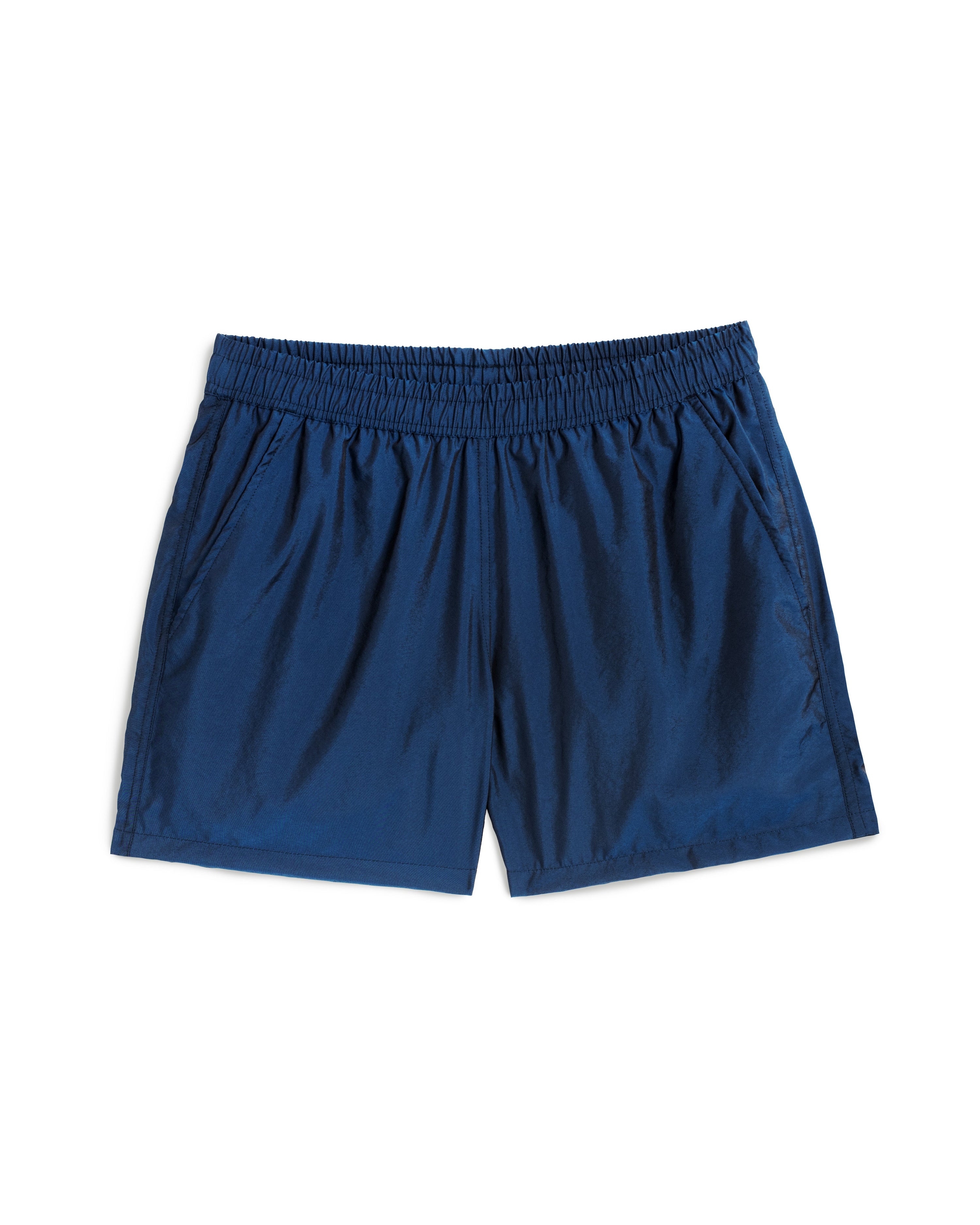 Men's shiny swim trunk in dark blue featuring an elastic drawstring waistband on white background