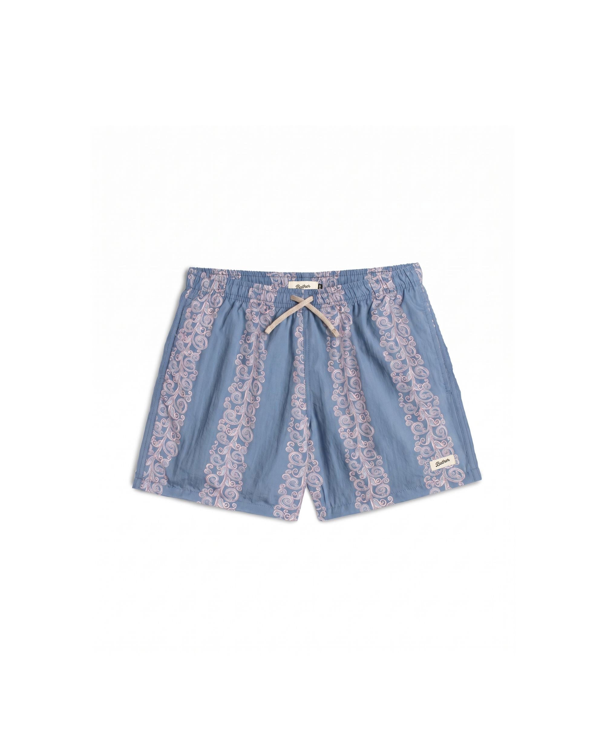 Blue shorts with lace trim on a white background