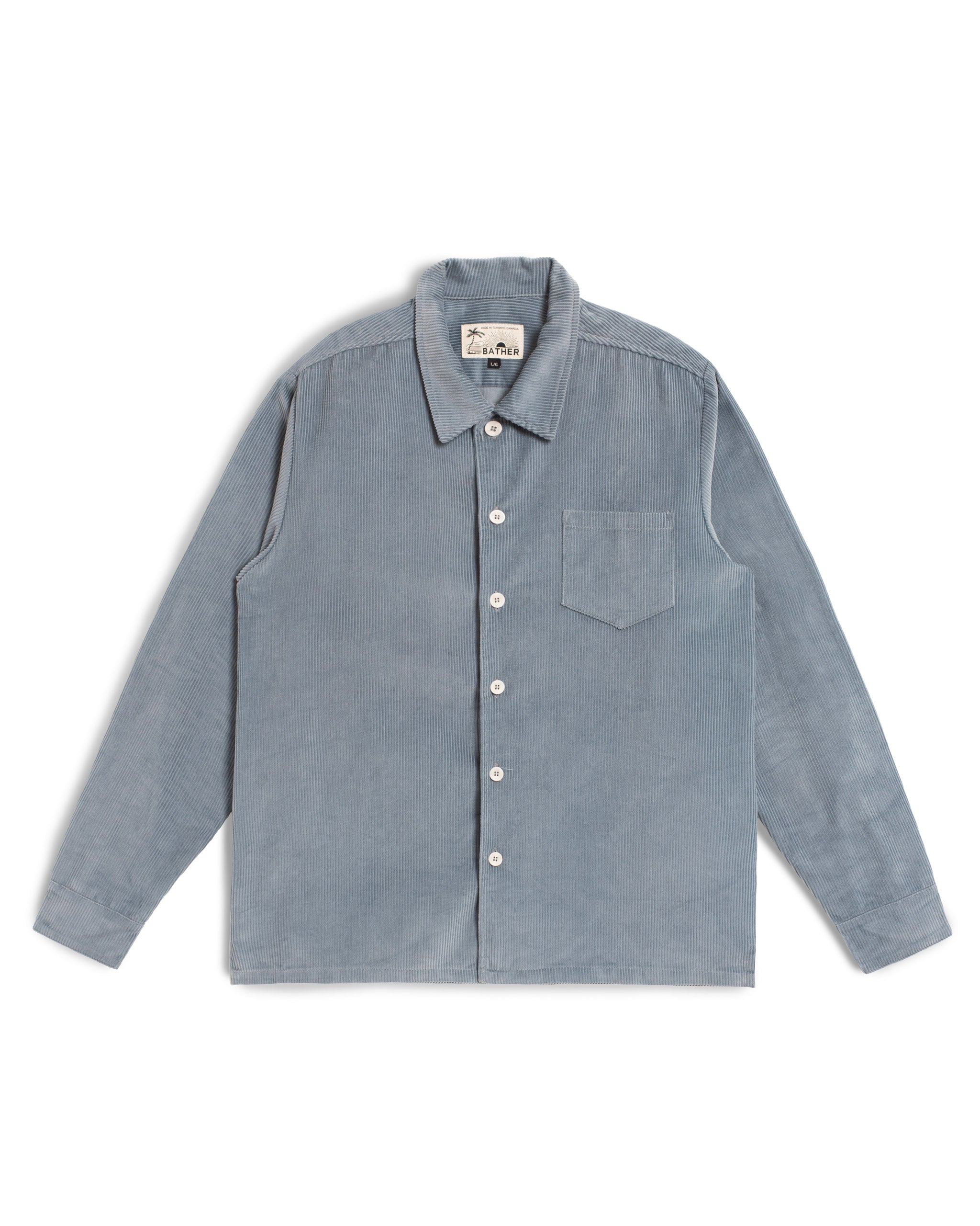 Front view of the Bather Men's light blue long-sleeve corduroy button-up shirt.