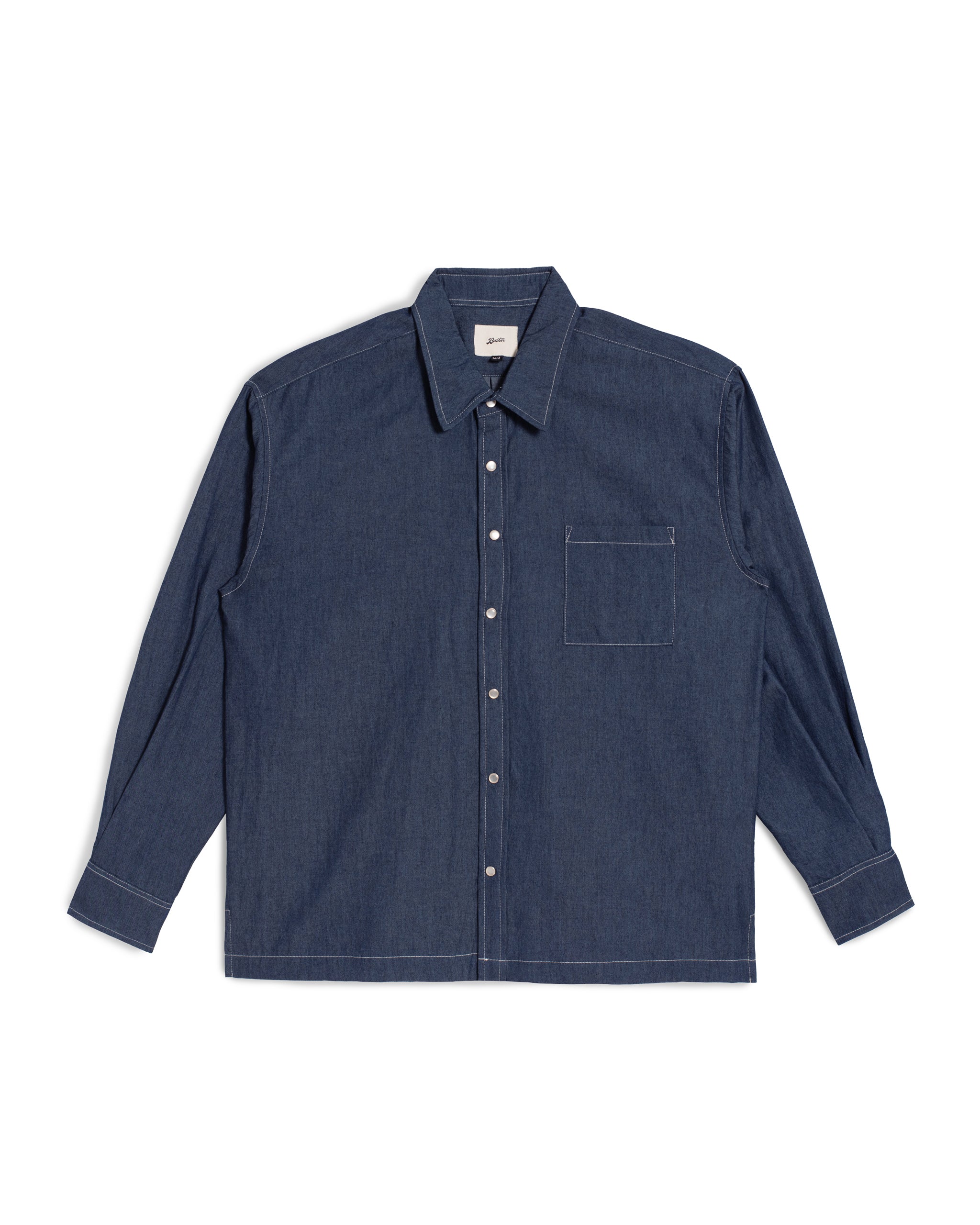 Bather Men's Rinsed Denim Leisure Shirt in a dark indigo wash, featuring a front-facing view of the lightweight Japanese denim, white snap buttons, a chest pocket, and contrast stitching on a white background.