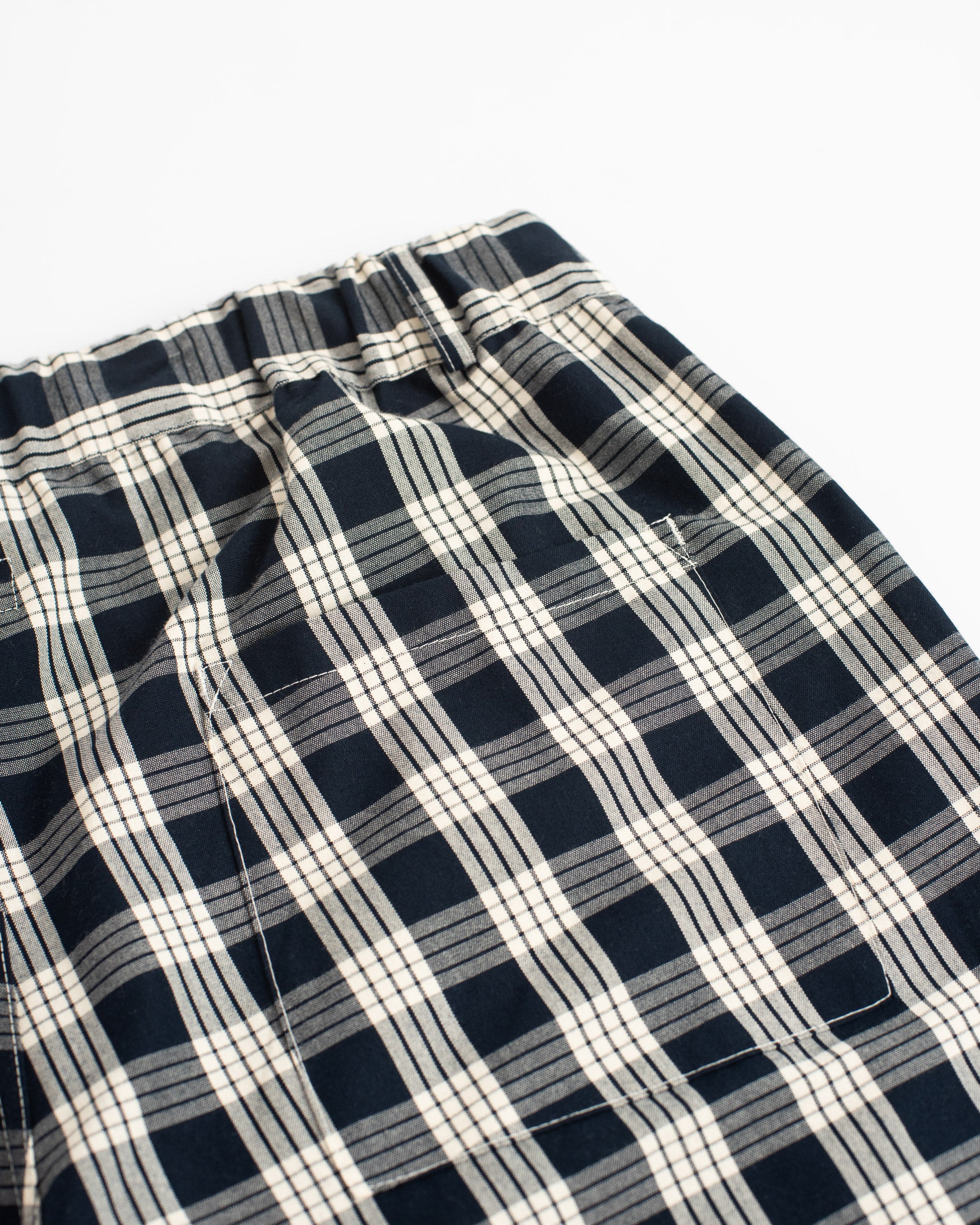 Bather Men's navy plaid short detail of back pocket on white background