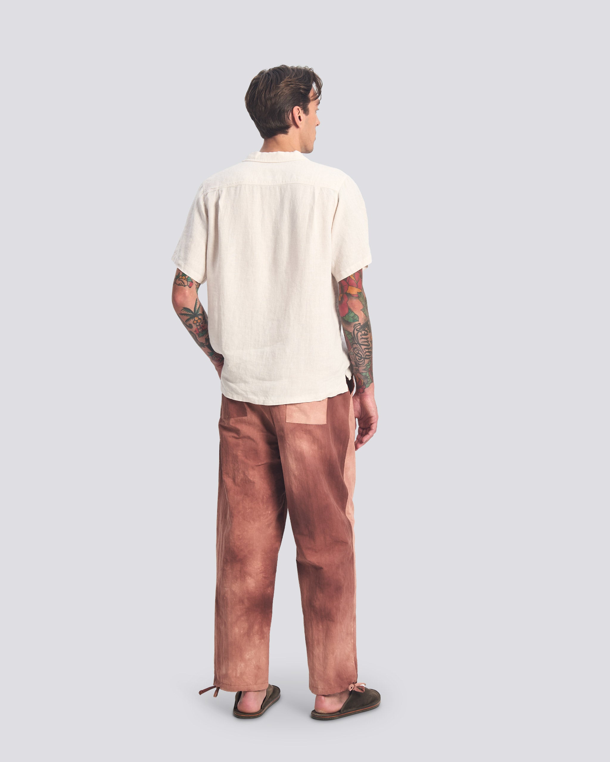 Back view of model wearing Bather men's red tie dye pant