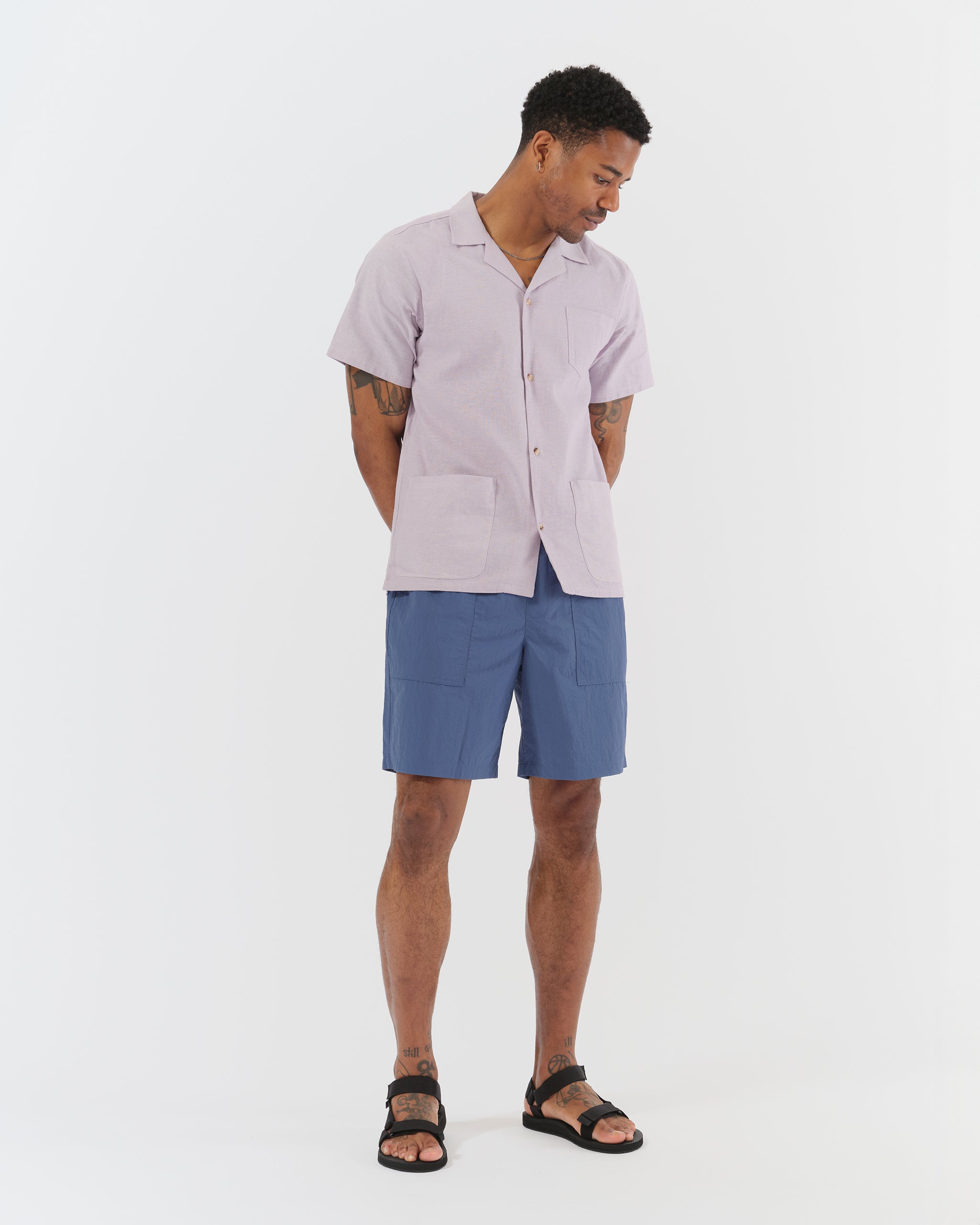 Model wearing Bather men's blue fatigue short in nylon ripstop fabric