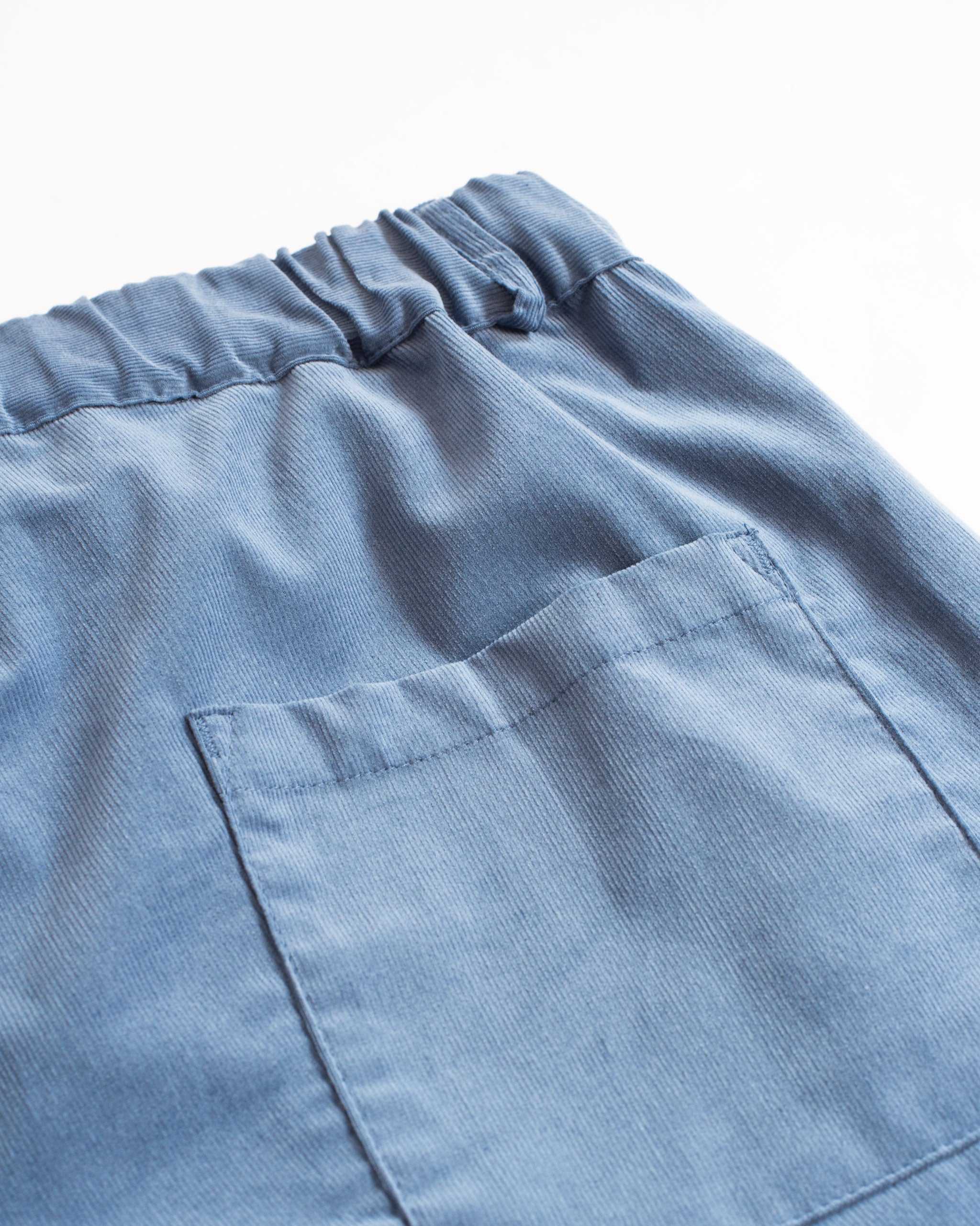 Back pocket view of Bather men's blue corduroy short