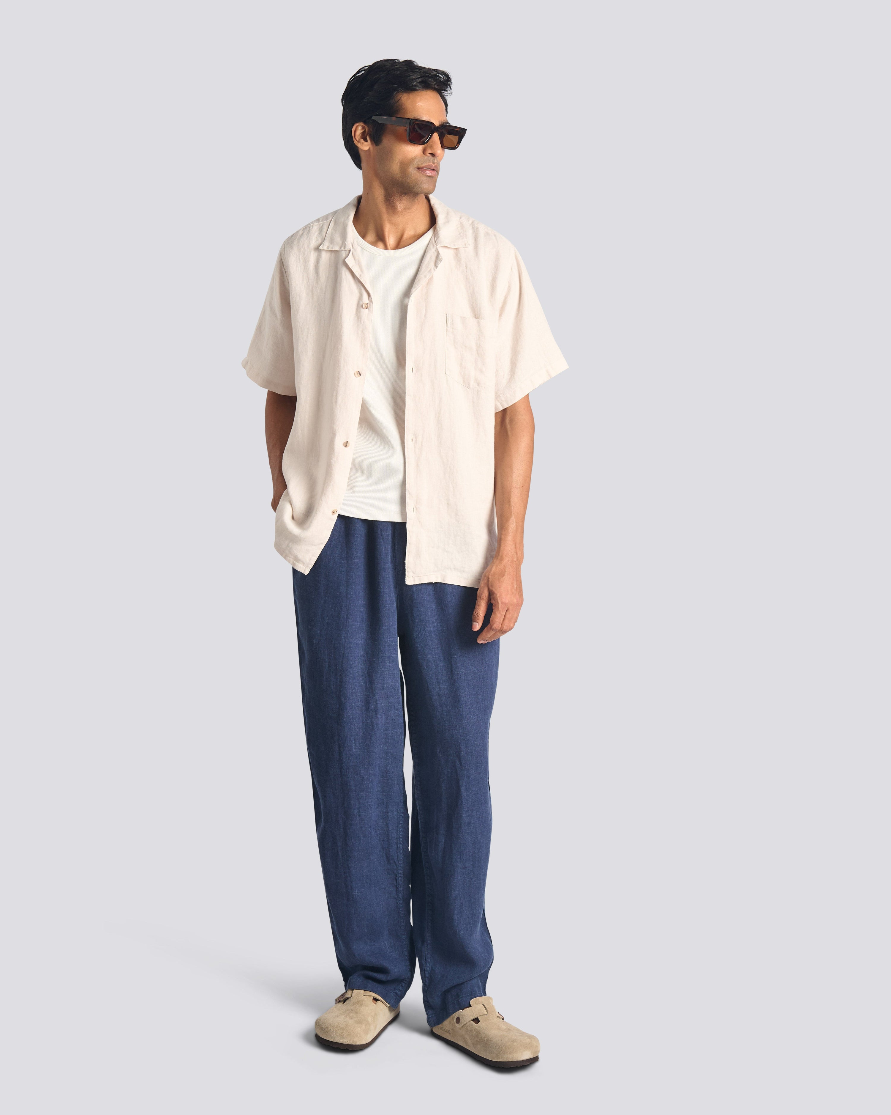 Model wearing Bather men's navy linen pant