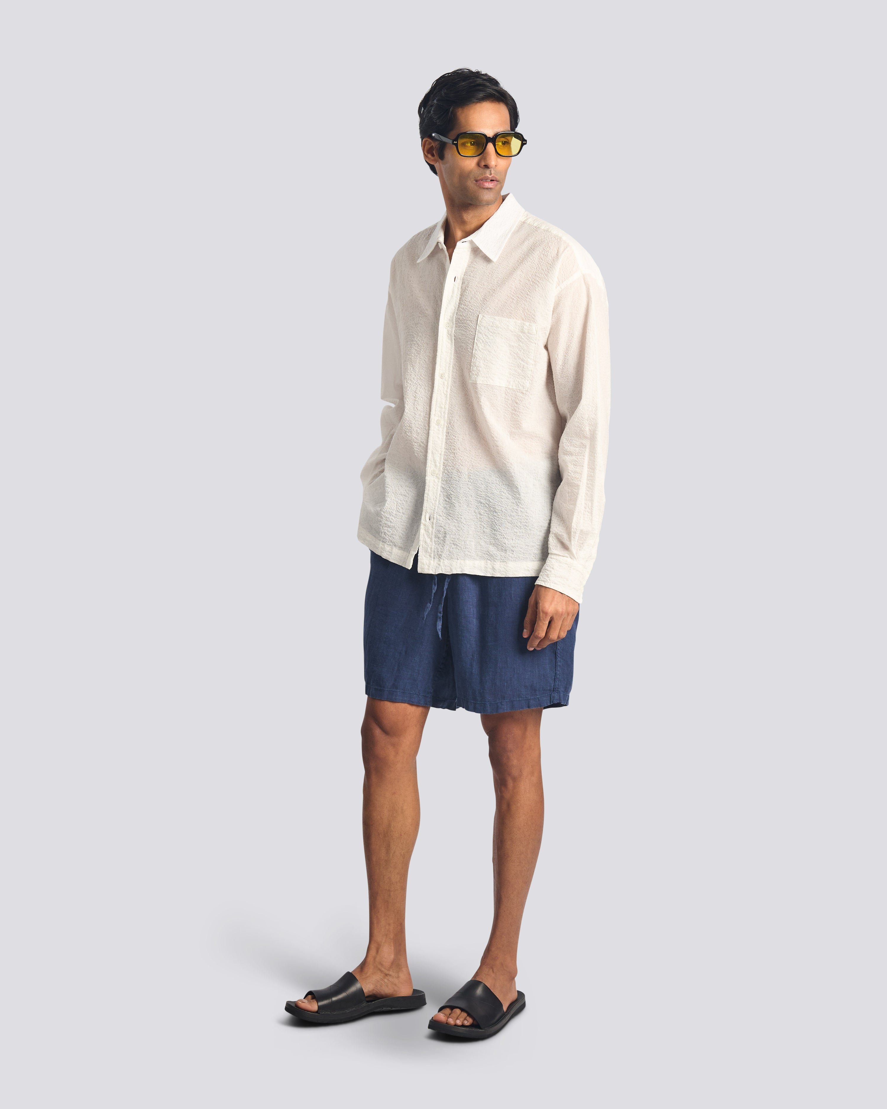 Model wearing Bather men's navy linen short with drawstring