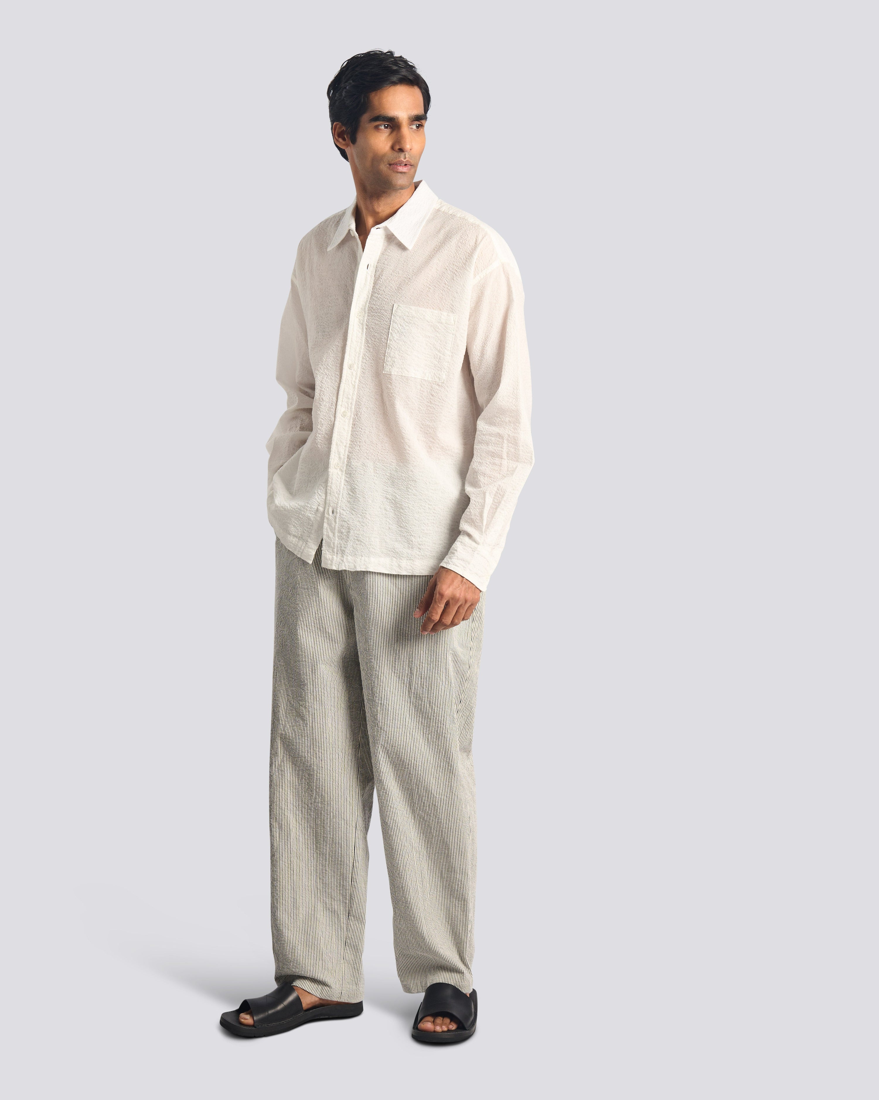 Model wearing Bather men's navy pinstripe pant
