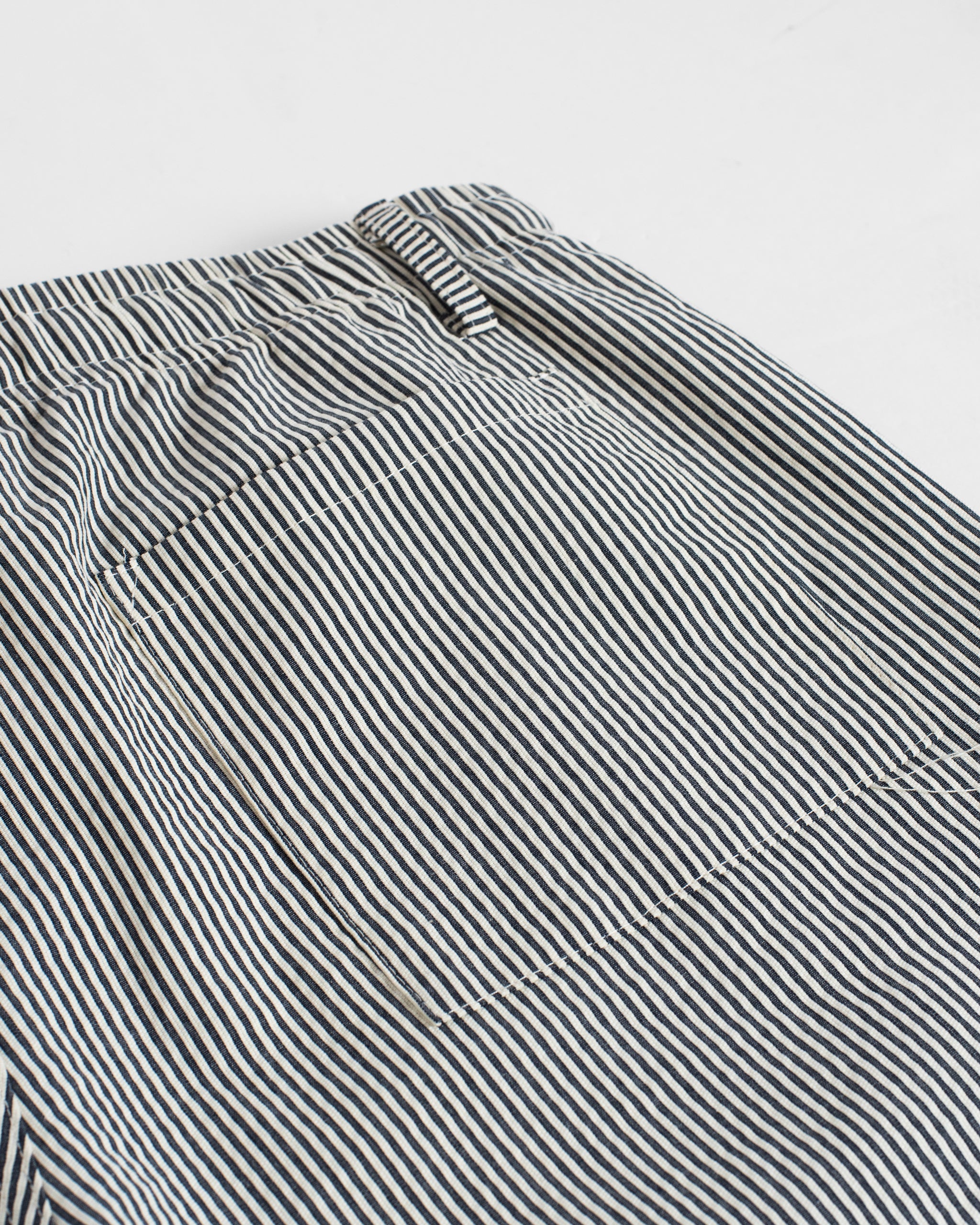 Closeup of back patch pocket on Bather men's navy pinstripe bottoms