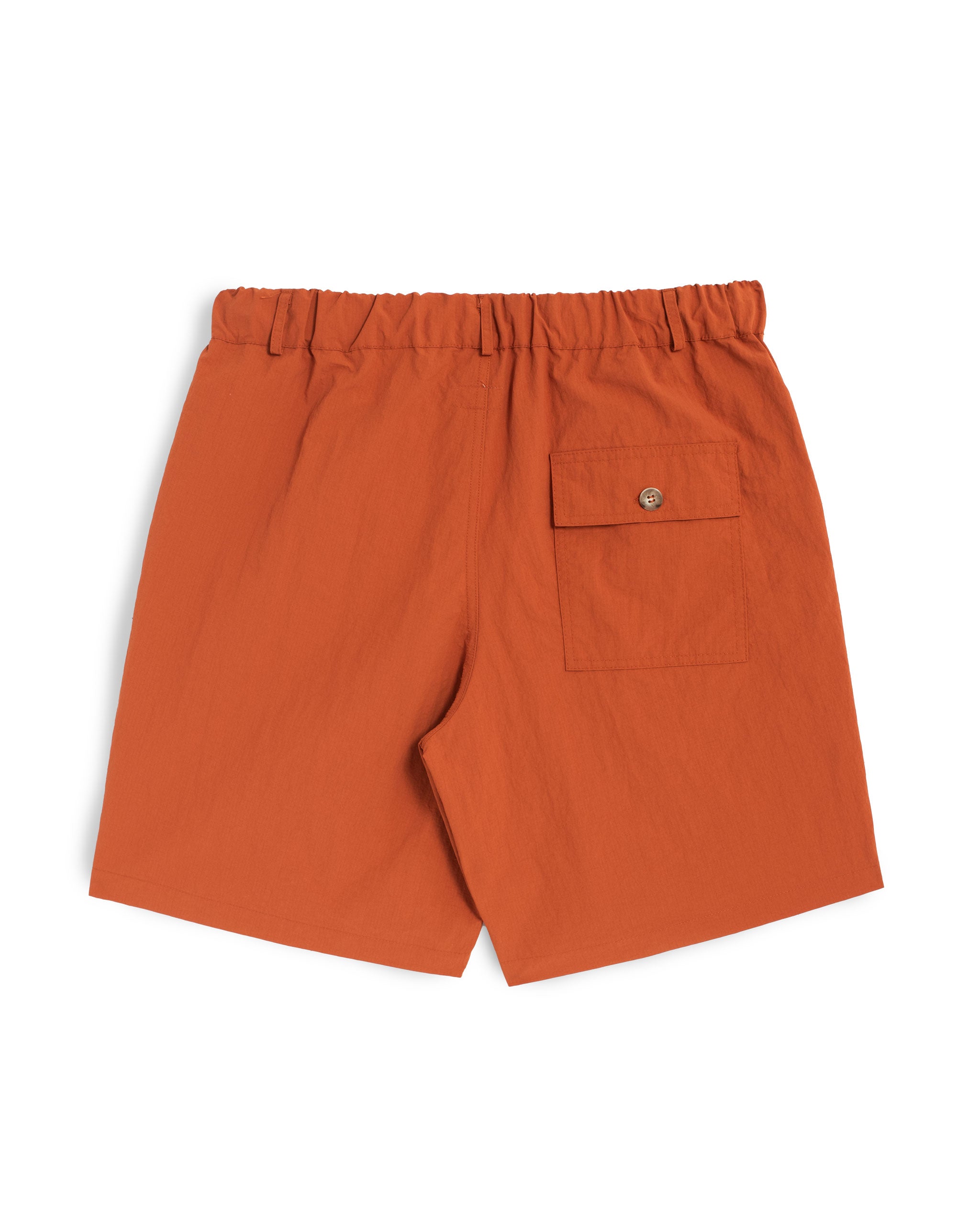 Back view of Bather men's solid orange nylon utility shorts with elasticized waist