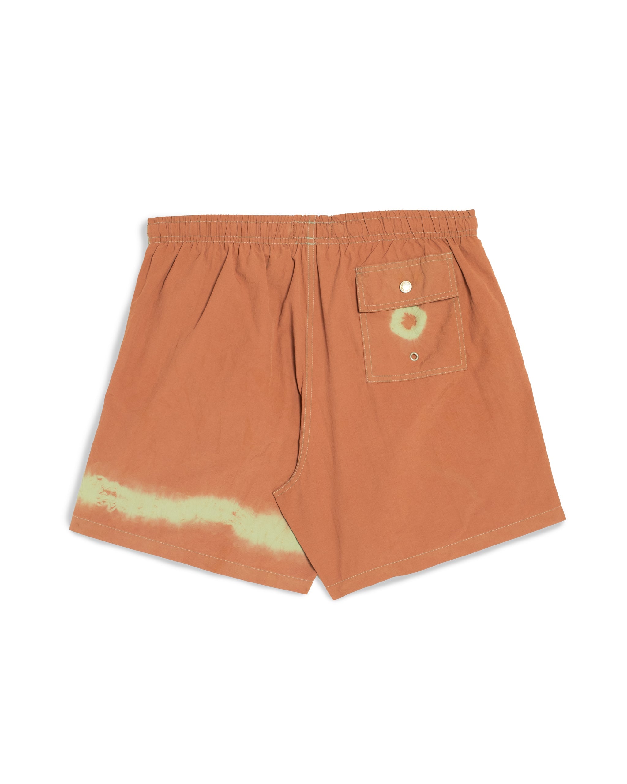 Orange swim shorts with a pocket and tie-dye detail on a white background