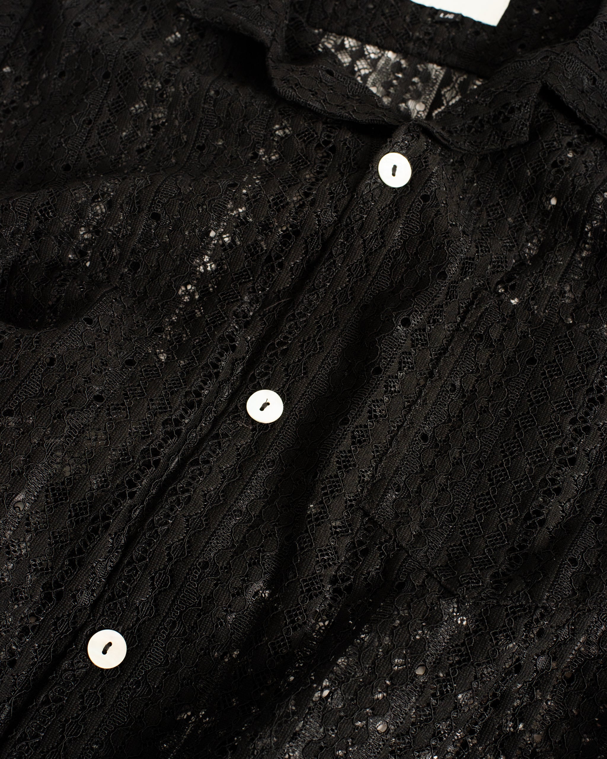 Black textured shirt lace shirt on a white background