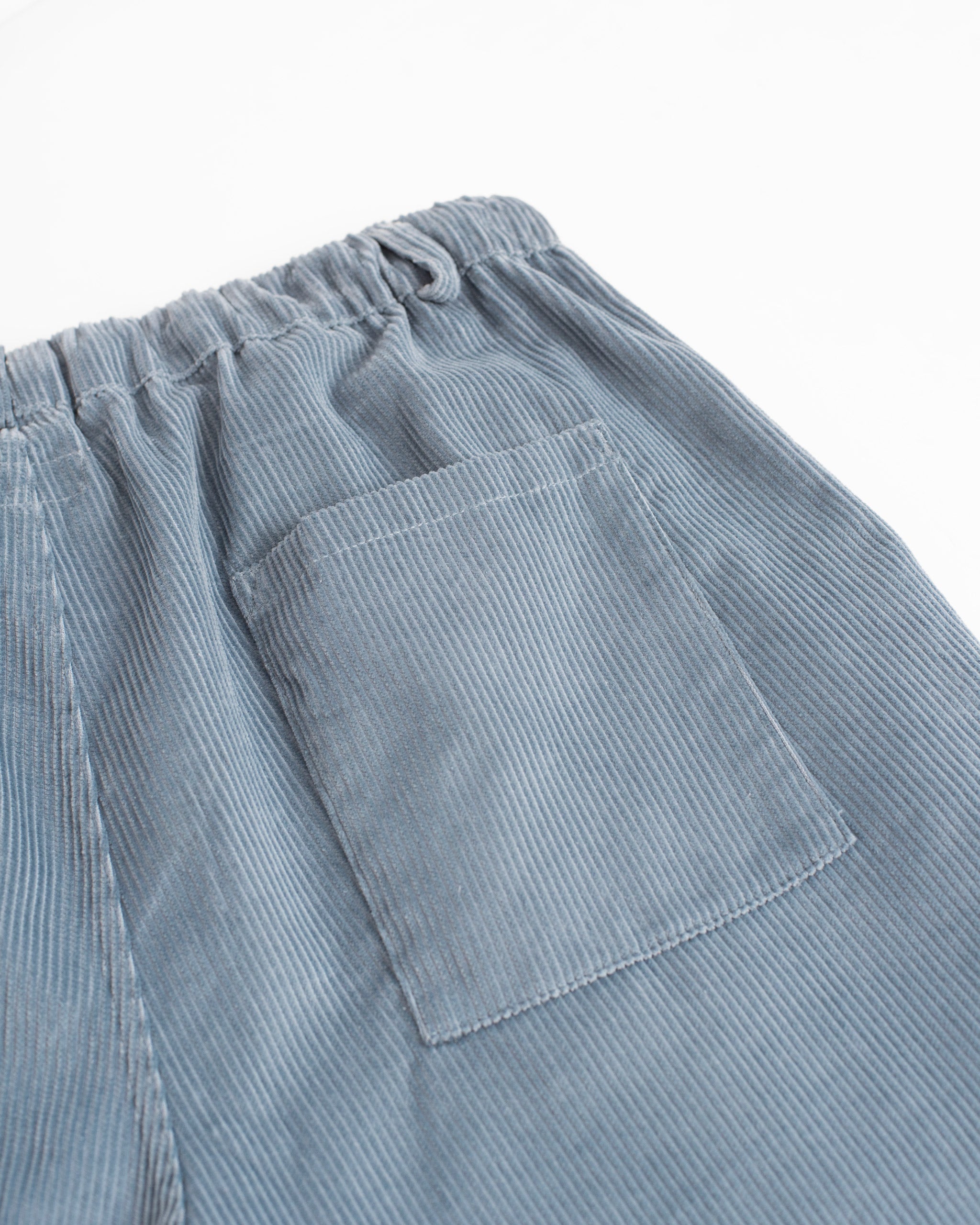 Closeup pocket detail of Bather men's blue corduroy pant