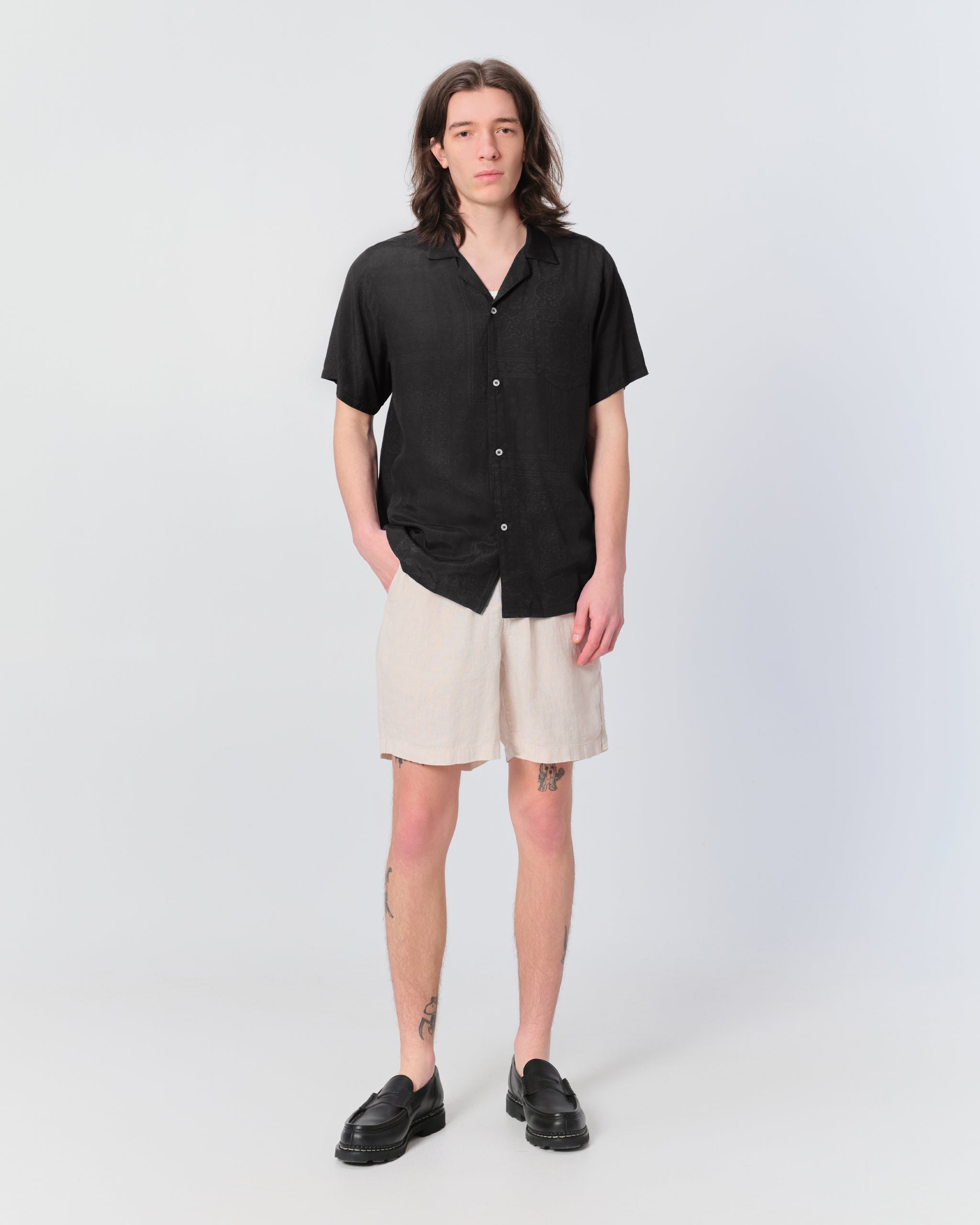 Model wearing Bather men's off-white linen short