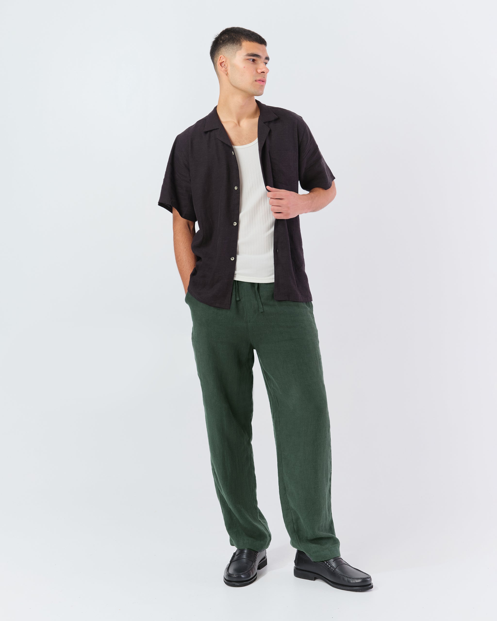 Model wearing Bather men's forest green linen drawstring pant