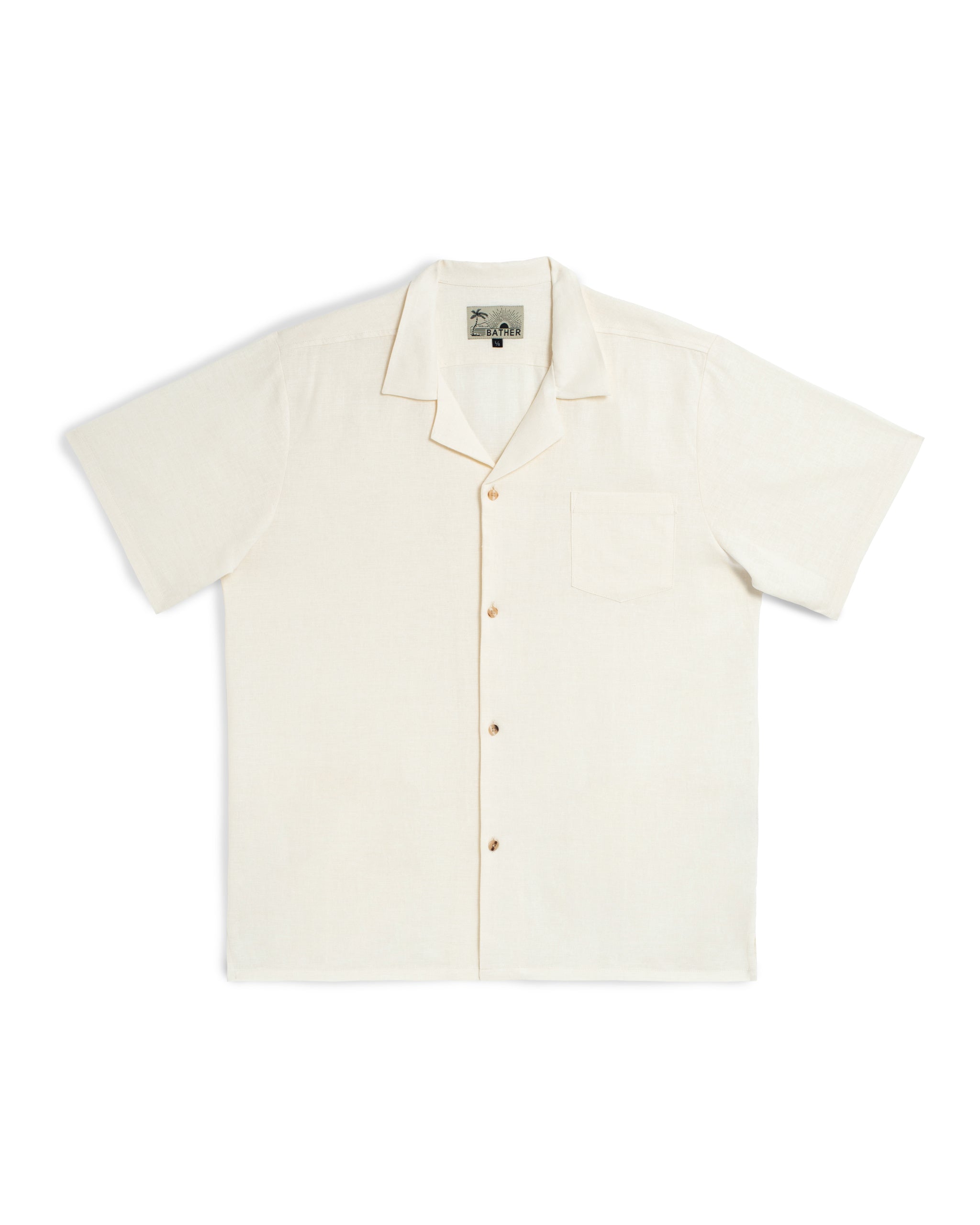 White Pearl Linen button down shirt laying flat with short sleeves and a camp collar