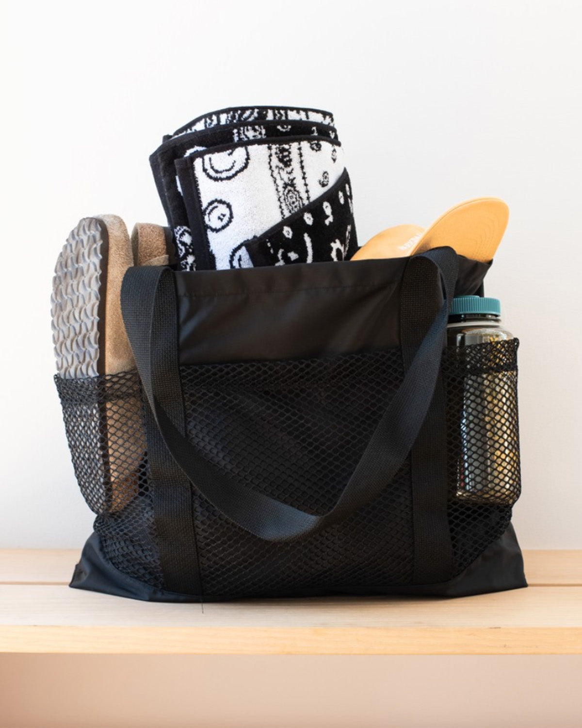 Front shot of Black Bather beach tote bag with mesh compartments 
