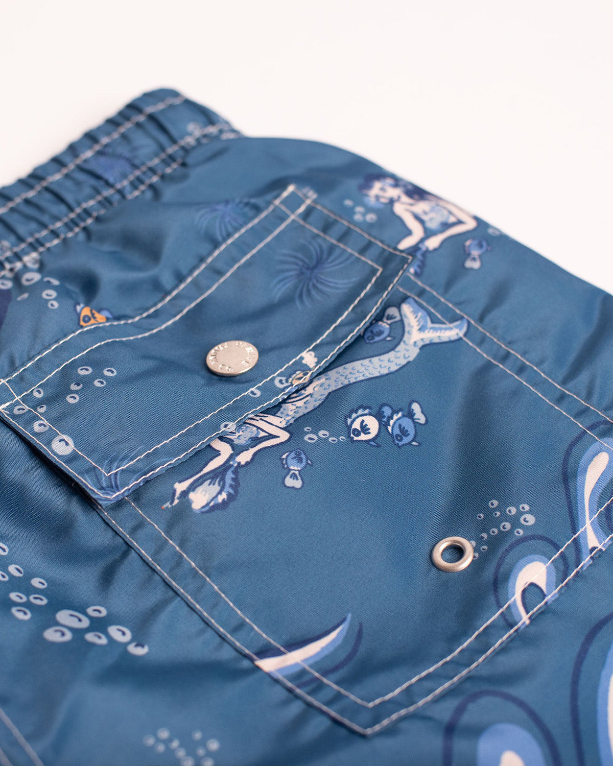 Close up of Bather swim trunk with siren pattern 