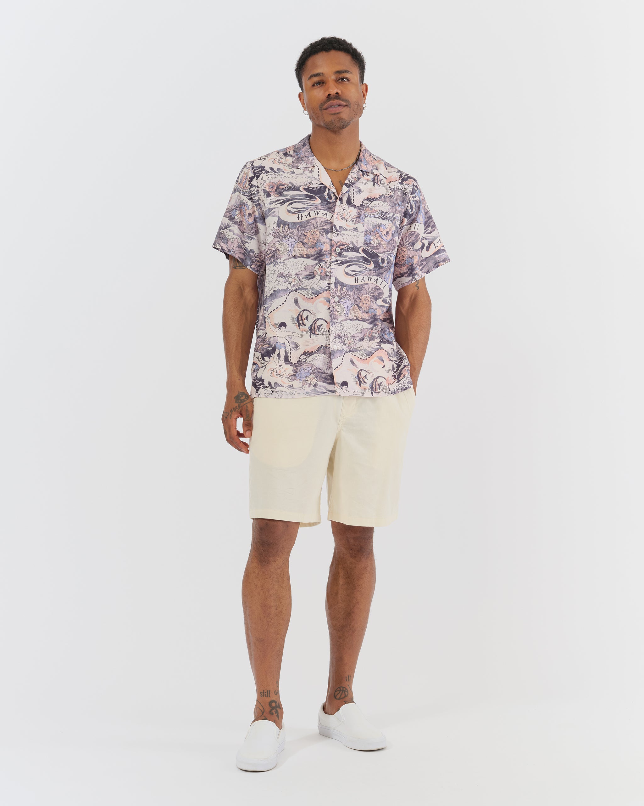 man standing wearing hawaiian shirt