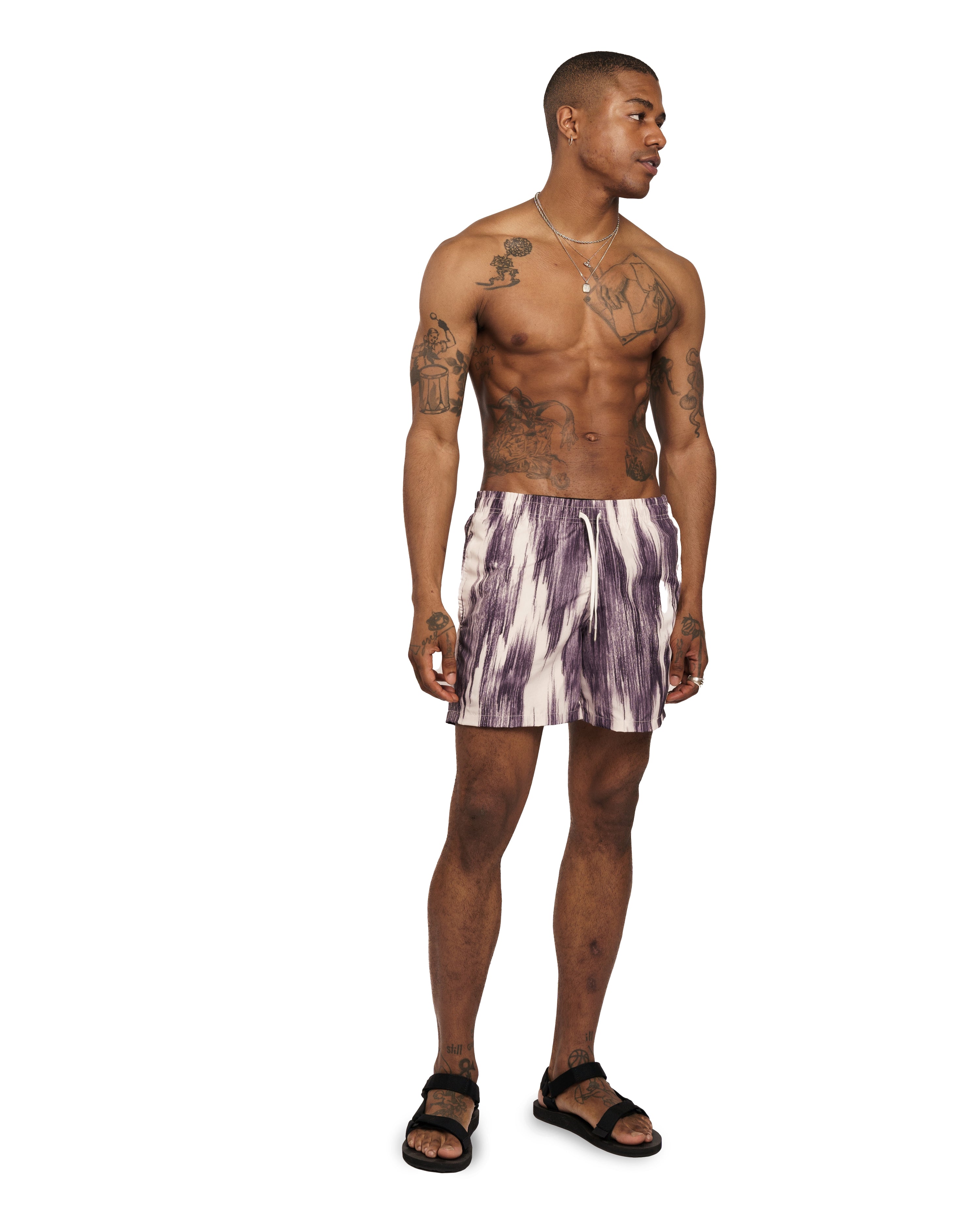model view of purple and white Bather swim trunk with a color clashing pattern