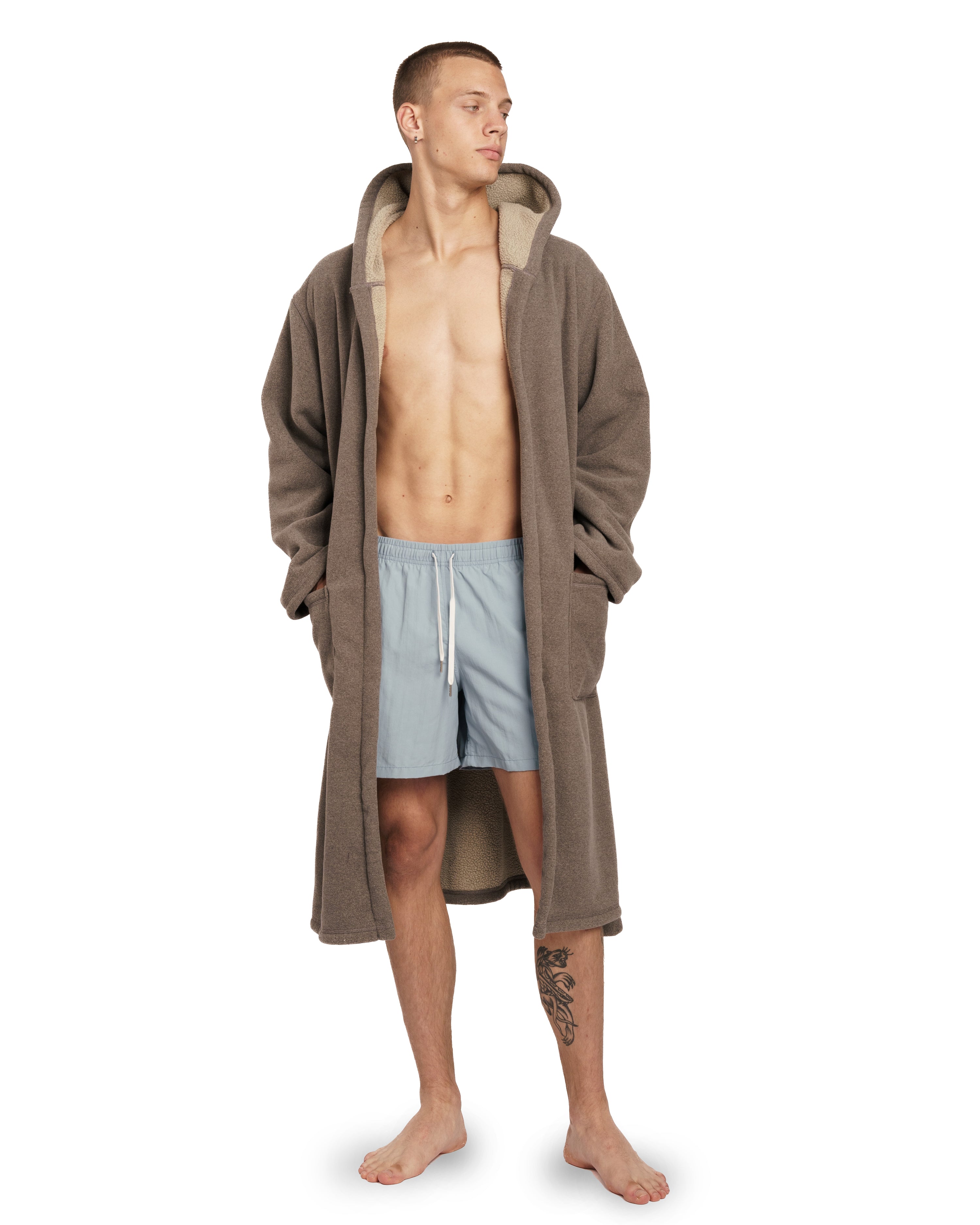 model wearing ivory Bather fleece robe with hood and belt