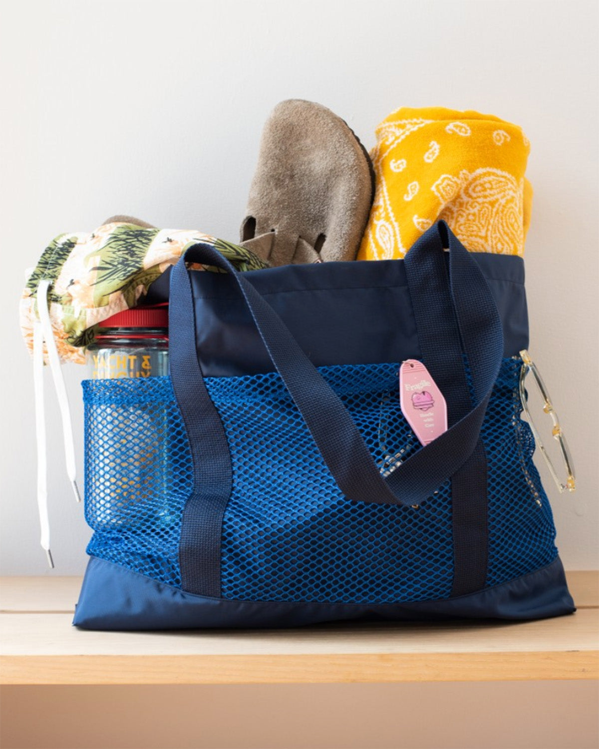 navy Bather tote bag with mesh compartment filled