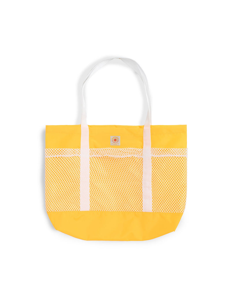 yellow Bather beach tote with white mesh compartments 