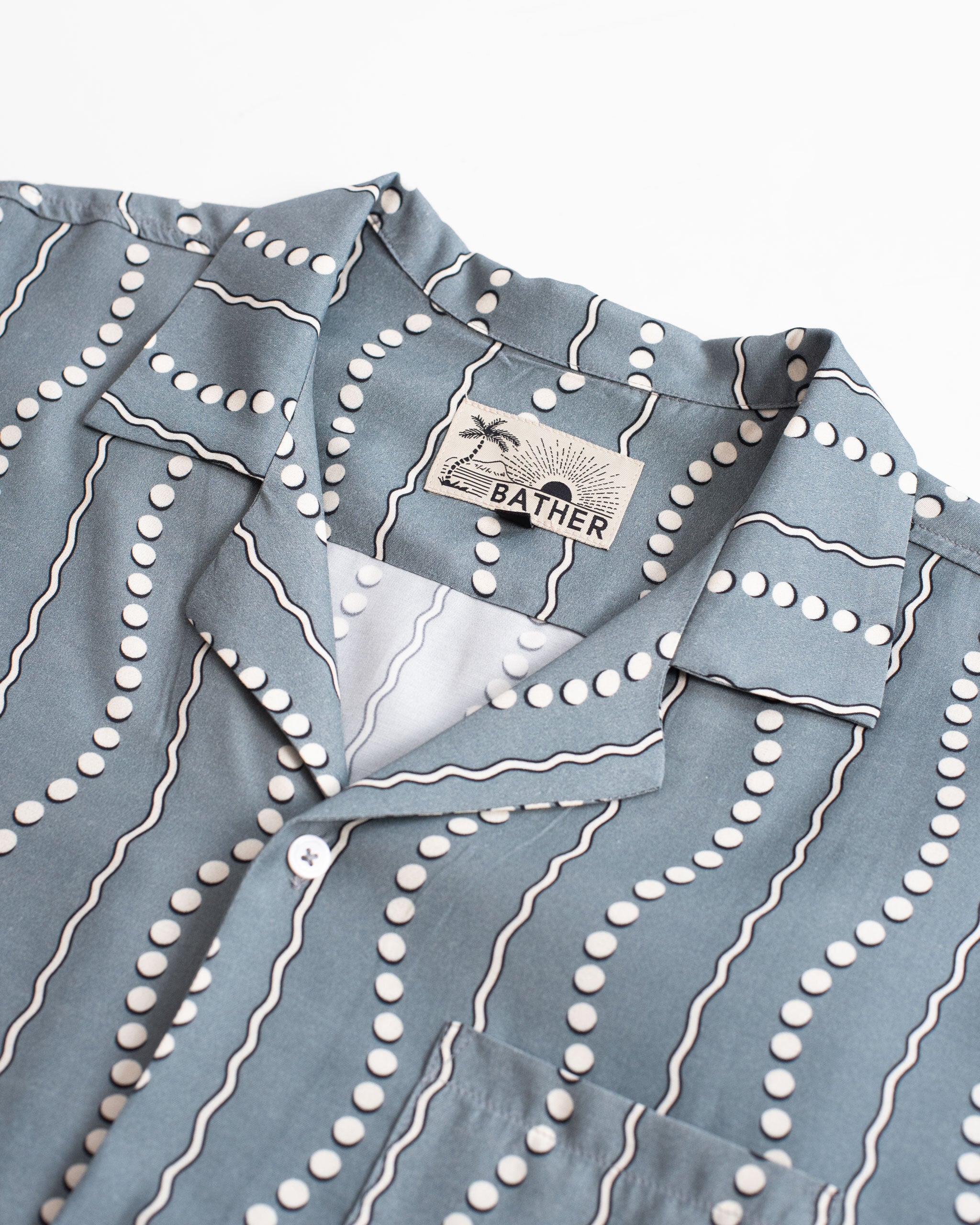 Close up view of Steel Blue Tidal Current Motif Striped Camp Shirt