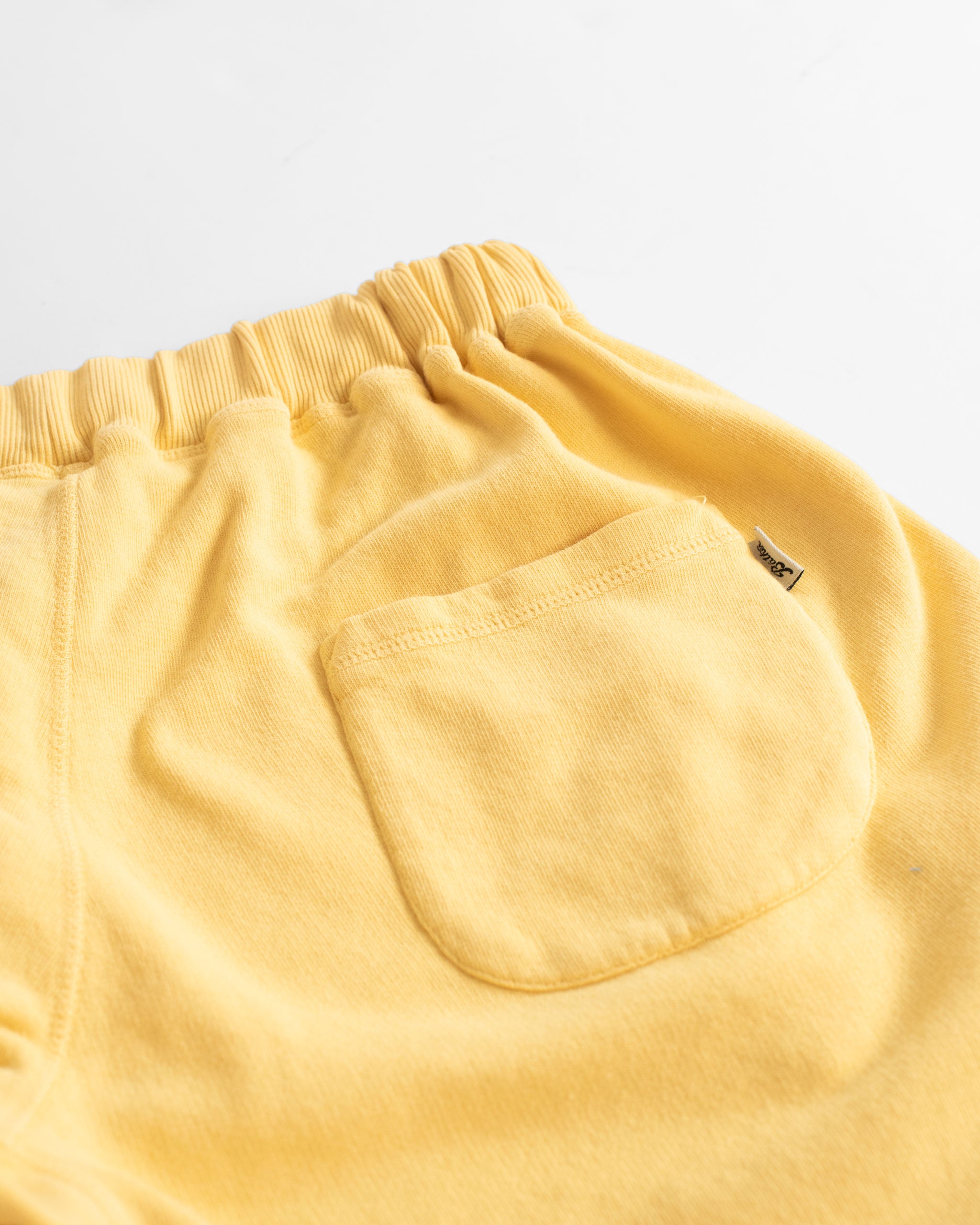 Back pocket shot of Solid Canary Yellow French Terry Sweat Shorts