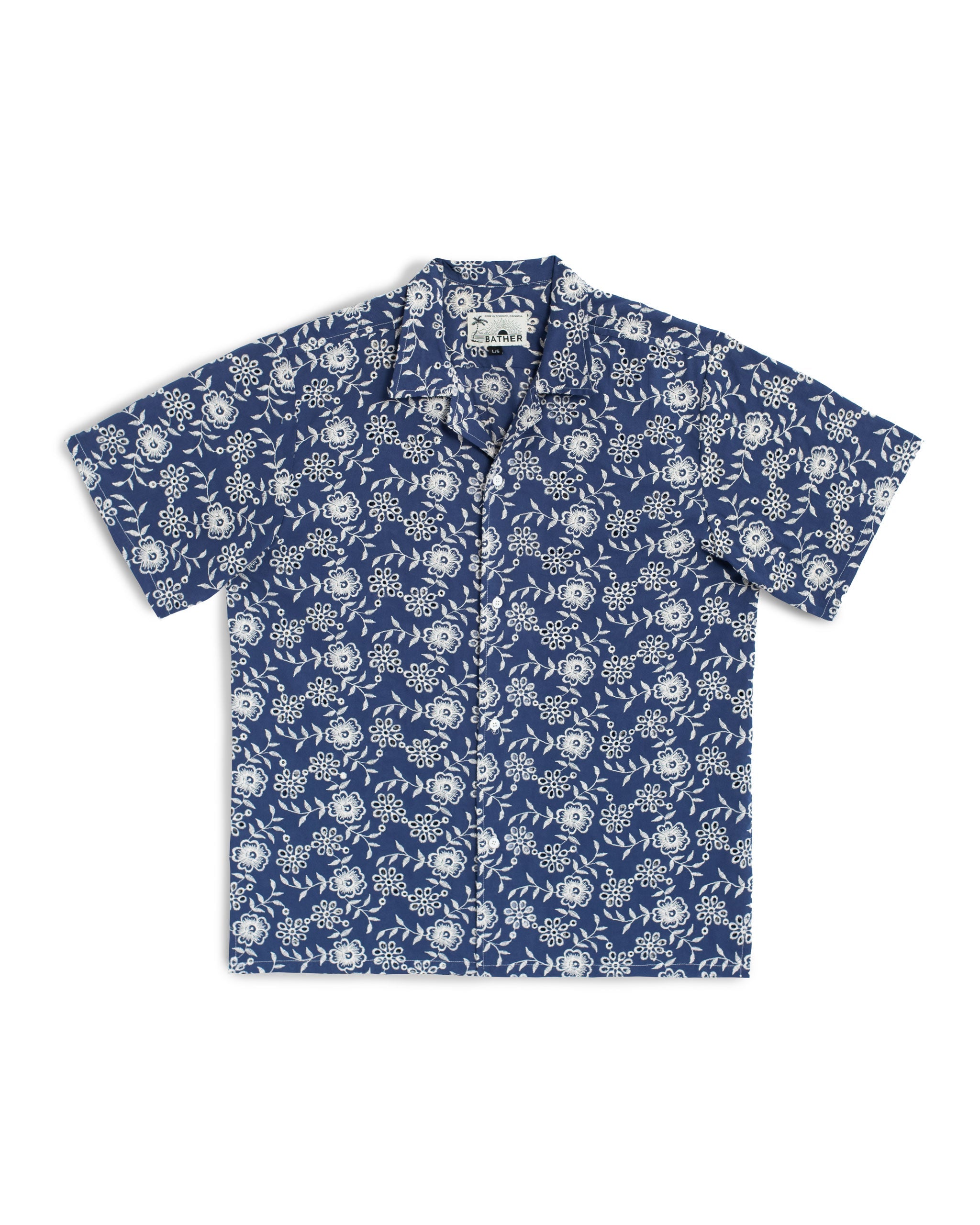 Blue camp shirt with an embroidered floral pattern