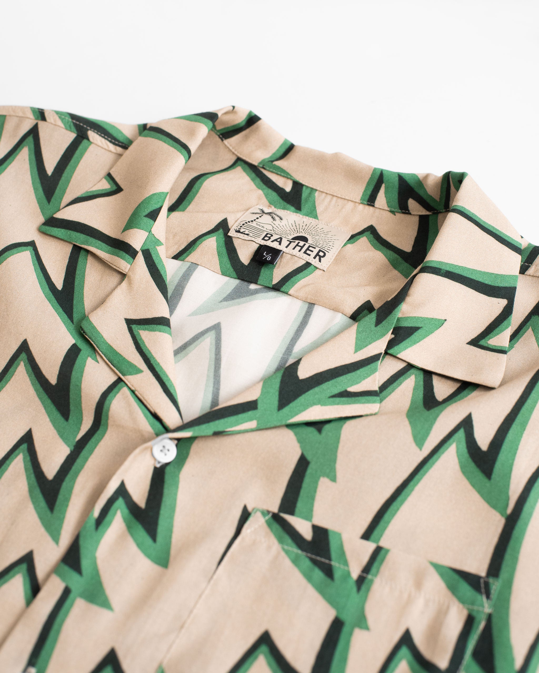 collar close up of Light brown, green, and black Jagged Frenzy Rayon Camp Shirt