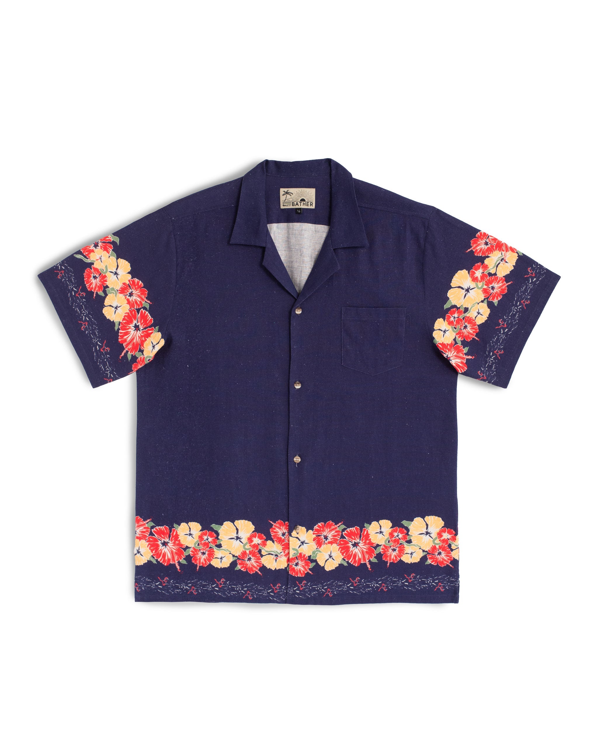 Indigo linen camp shirt with floral pattern on the bottom and the sleeves