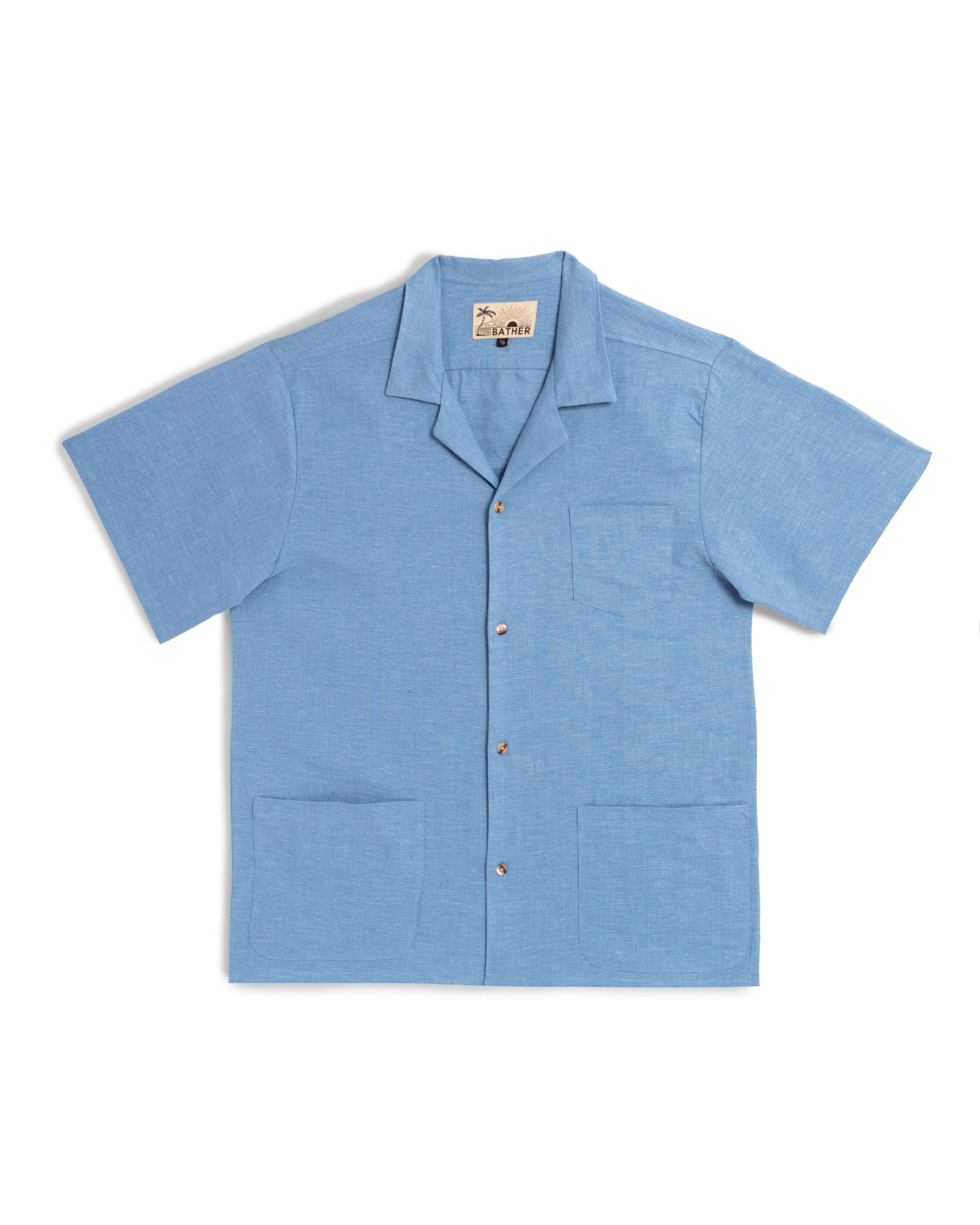 Blue linen camp shirt with a chest pocket and two bottom front pockets