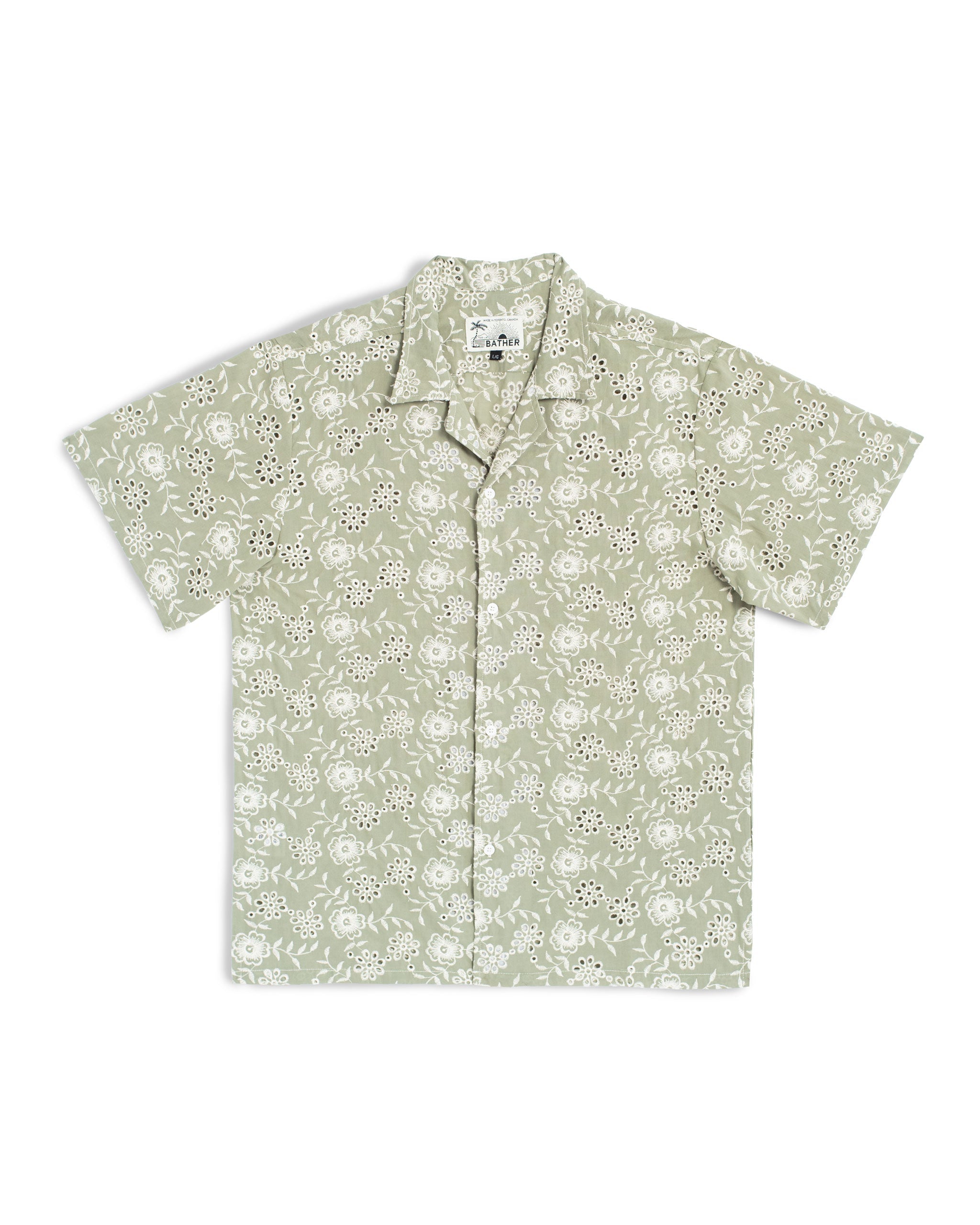 A sage green camp shirt with an all-over embroidered floral pattern