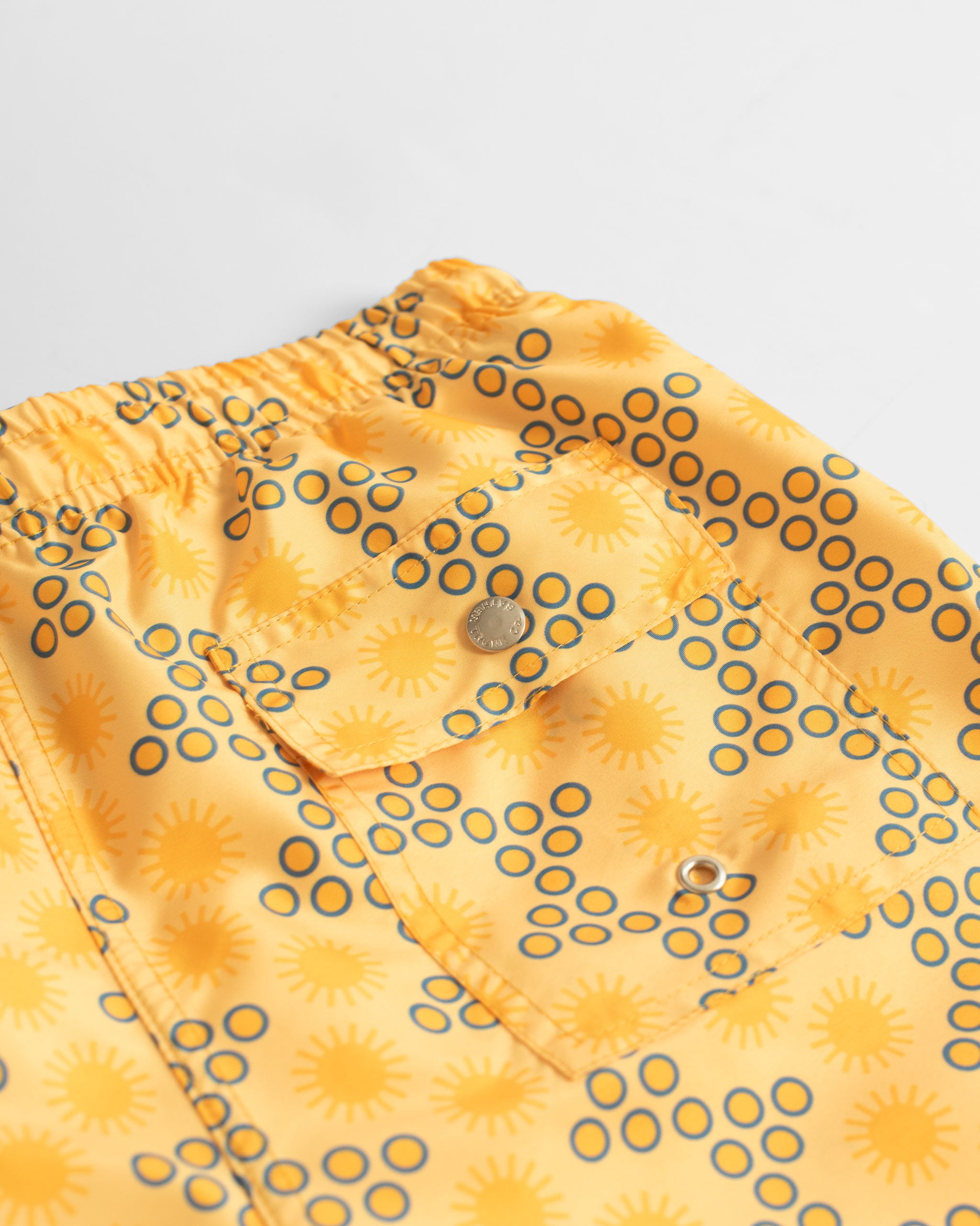 back pocket shot of Yellow Disco Sun Graphic Swim Trunks