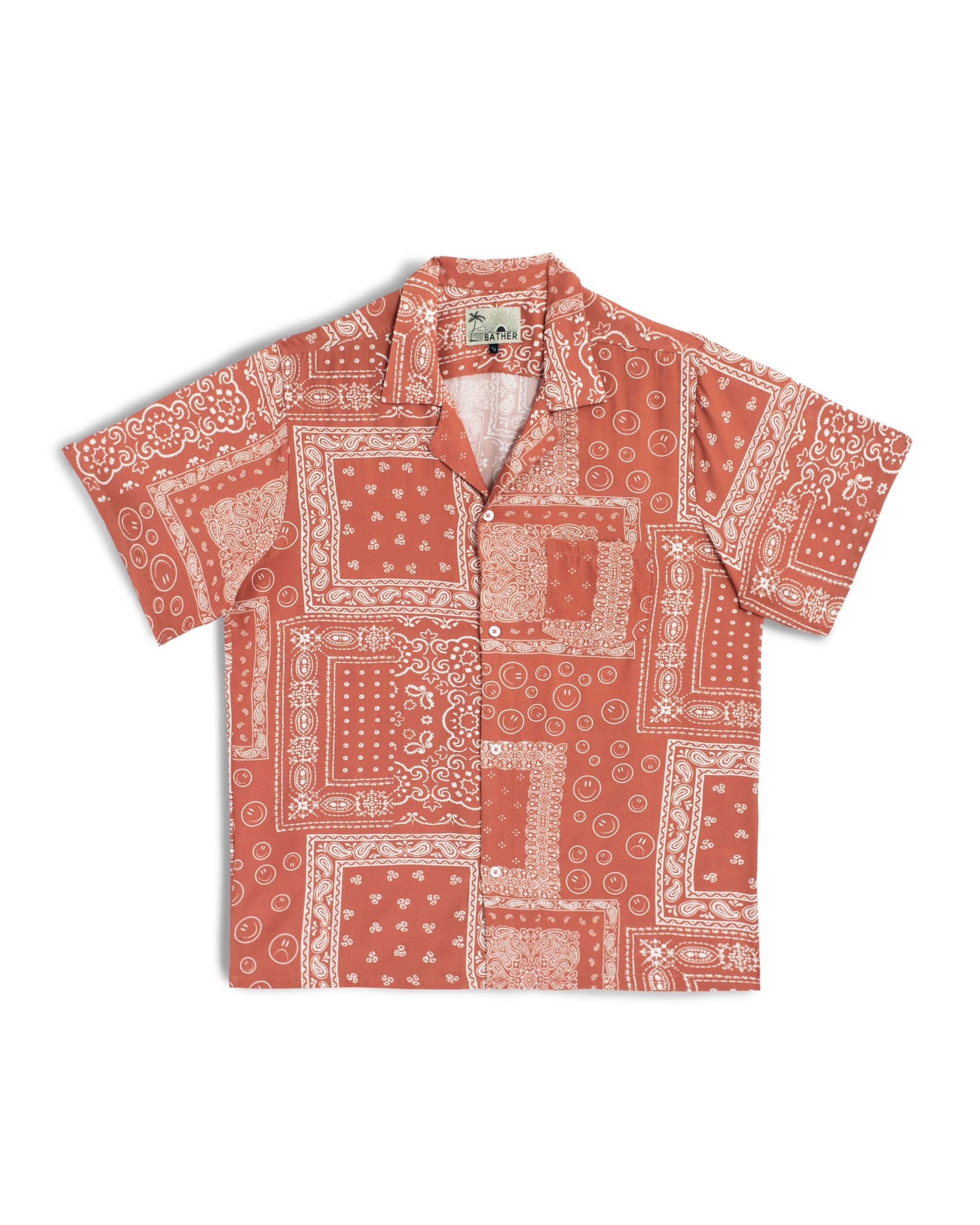 A terracotta red camp shirt with an all-over bandana print