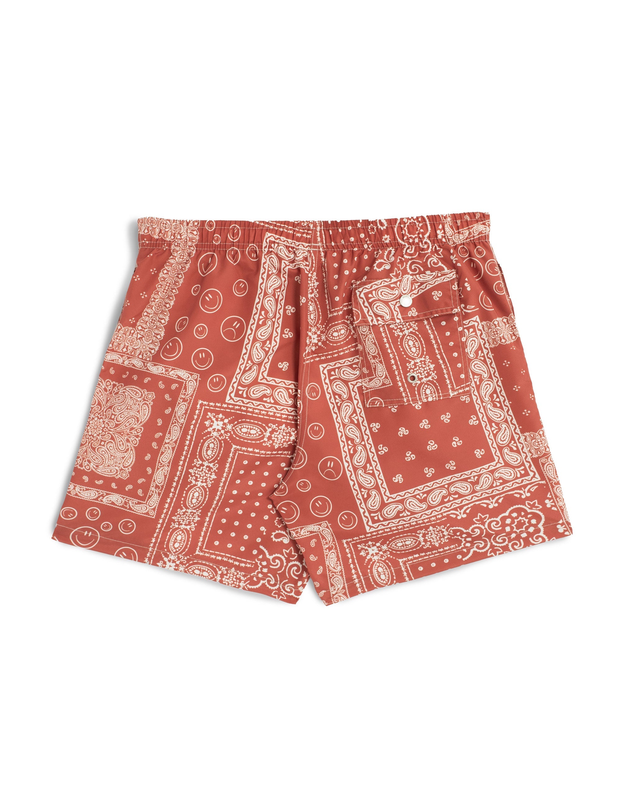 A terracotta red swim trunk with an all-over bandana print back shot 