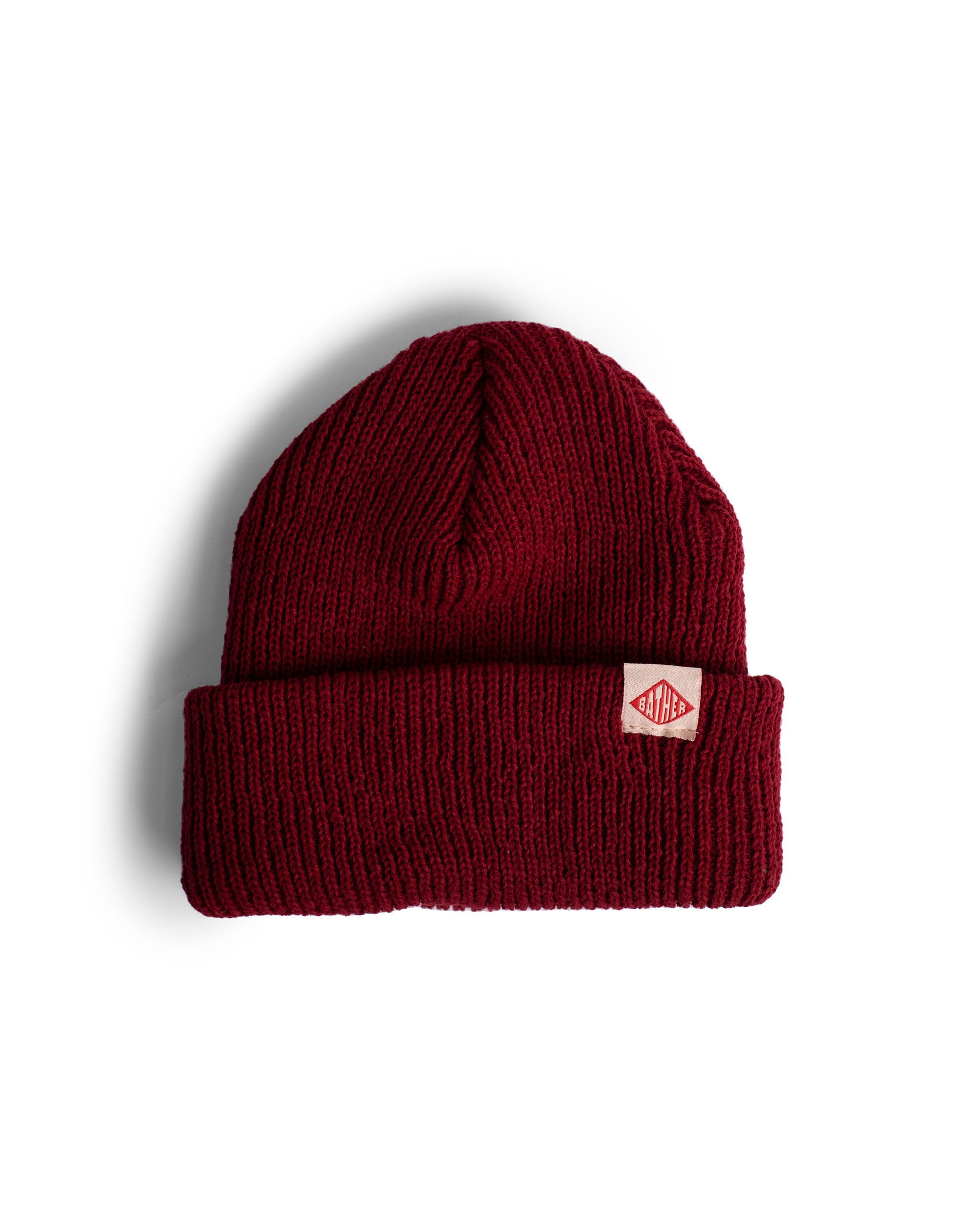 Red bather beanie with brand tag