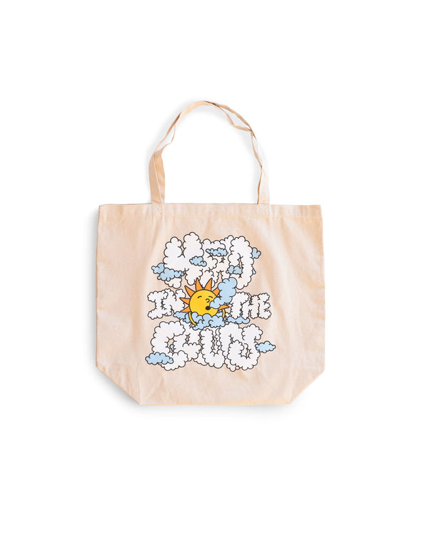 beige Bather tote bag with sun and clouds graphic