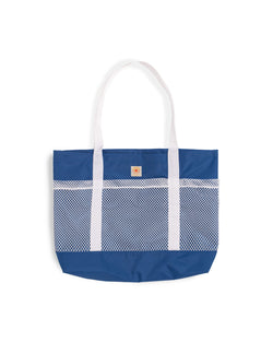 blue Bather beach tote with white mesh compartments 